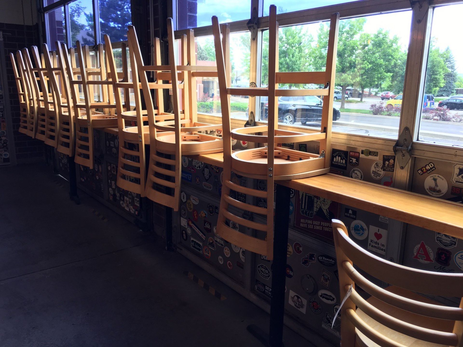 (10) Wooden Barstools and Window Tables | Rig Fee: $75 - Image 2 of 2