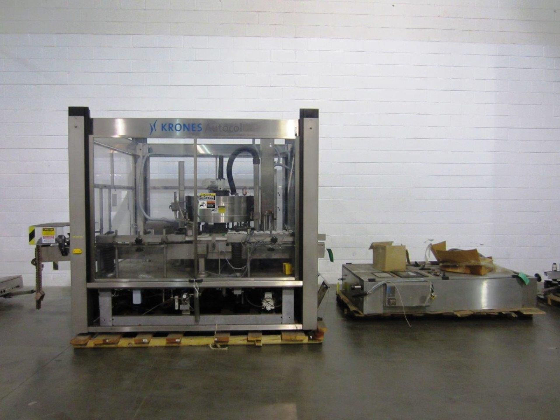 Krones Front/Back High Speed Pressure Sensitive Labeler, Model: Autocol, | Loc: GA | Rig Fee: $500