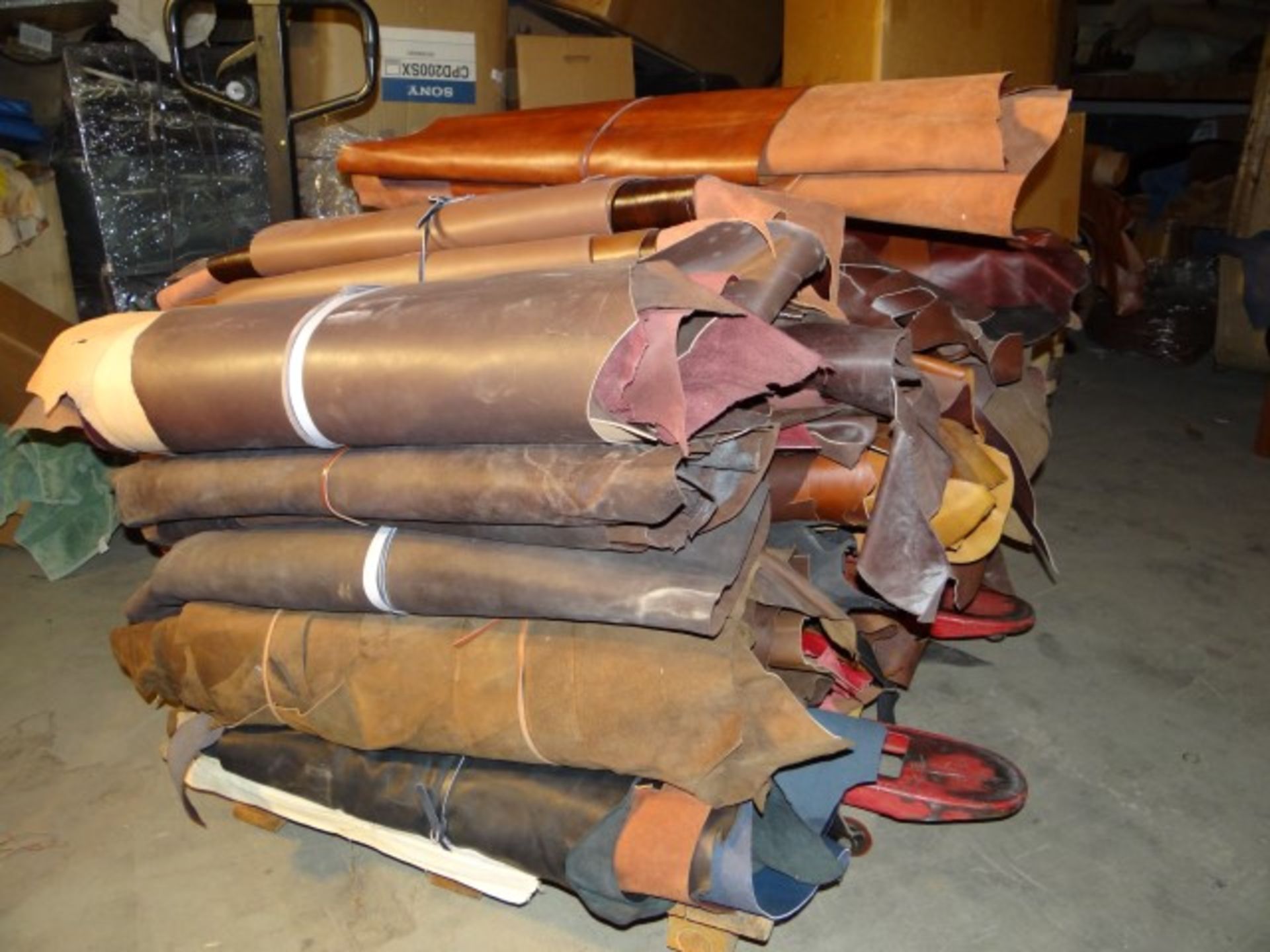 (600) Pounds of Leather. Assorted Colors and Thicknesses. Each Piece is at least 10 Sq.Ft.