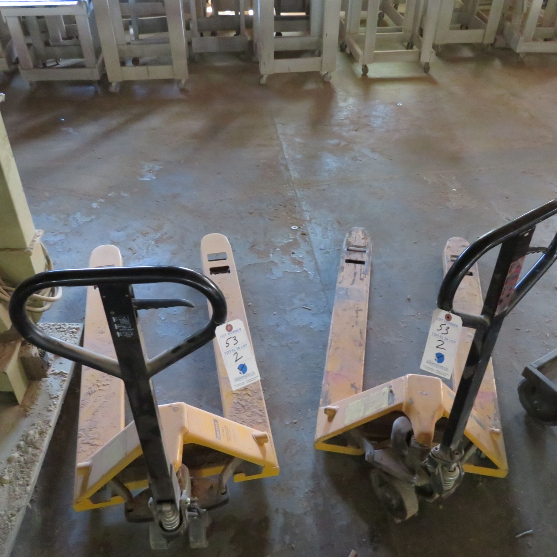 (2) Uline 5500 Lb. Capacity Pallet Jacks (1 Works, 1 For Parts)