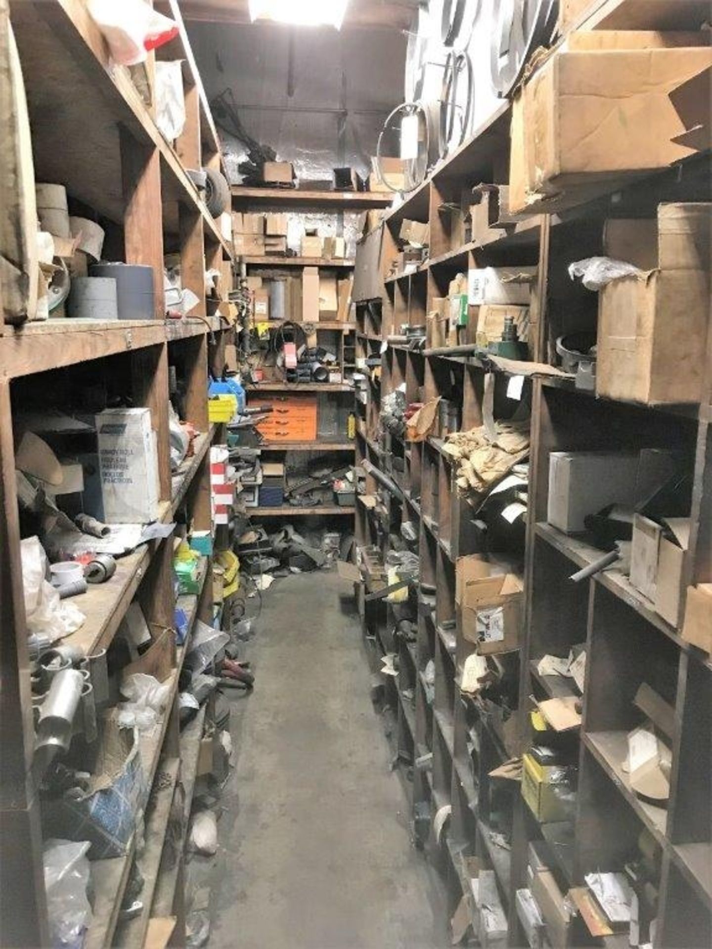 CONTENTS OF MACHINE SHOP PARTS ROOM WITH FACILITY MAINTENANCE AND SPARE MACHINE PARTS.