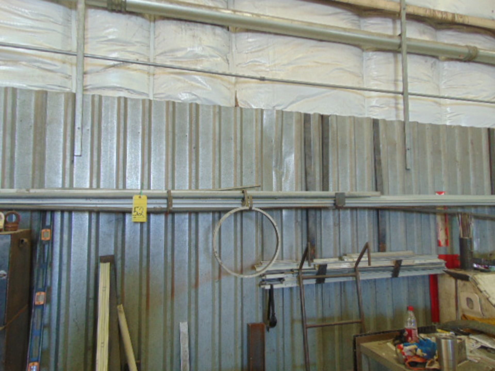 LOT OF RAW MATERIAL: assorted aluminum & pipe (located on wall)