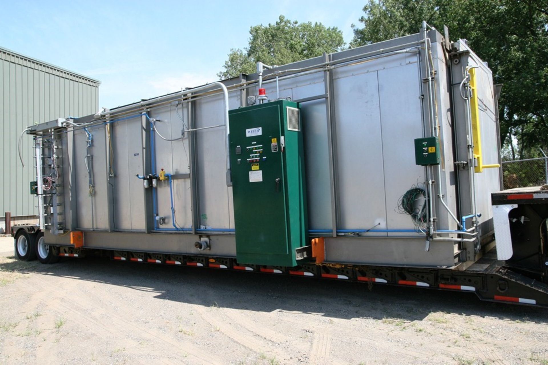 FECO BATCH OVEN, electrically heated batch oven with a vertical lift door on each end. Work