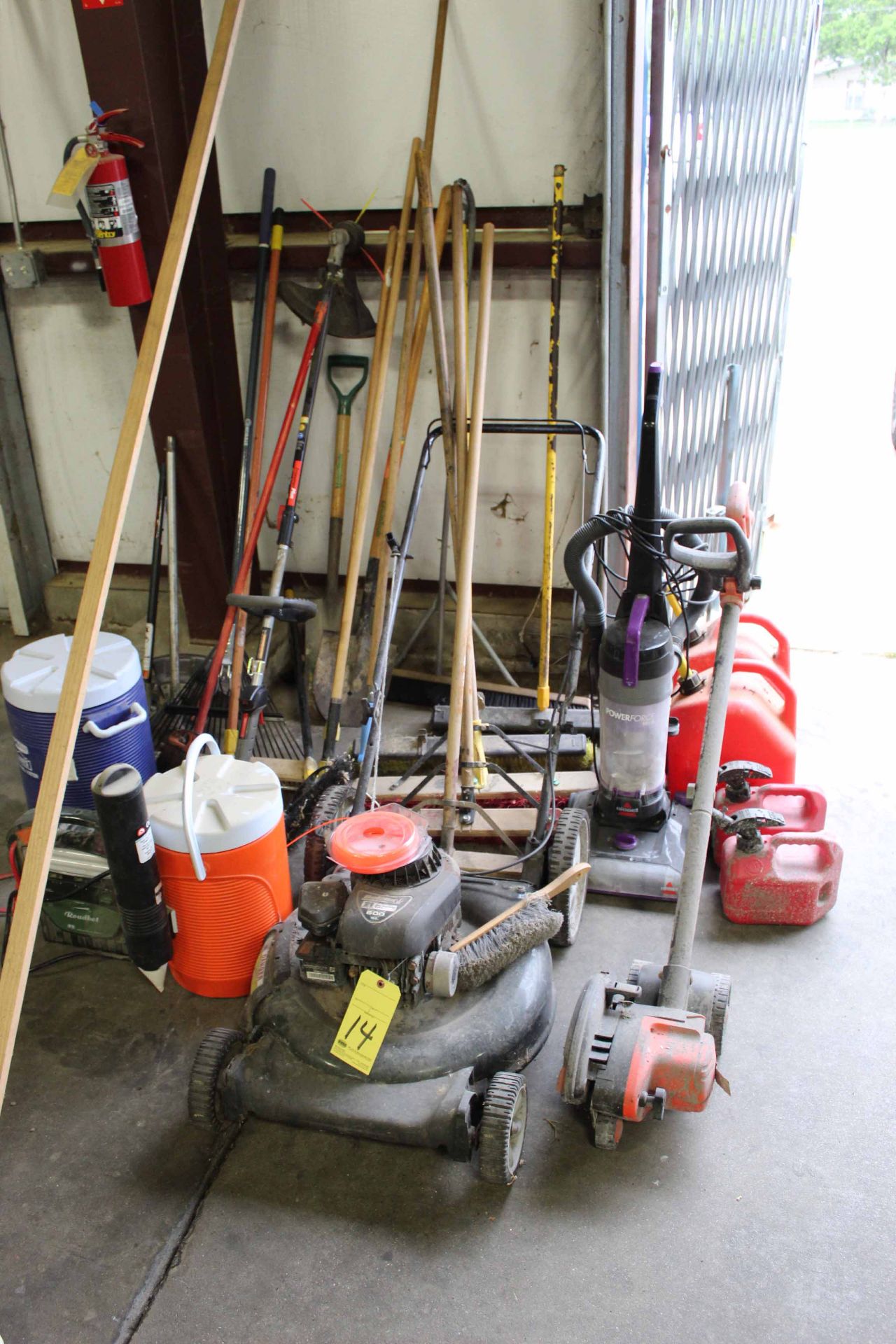 LOT OF LANDSCAPING EQUIPMENT: mower, weed eater & shovels