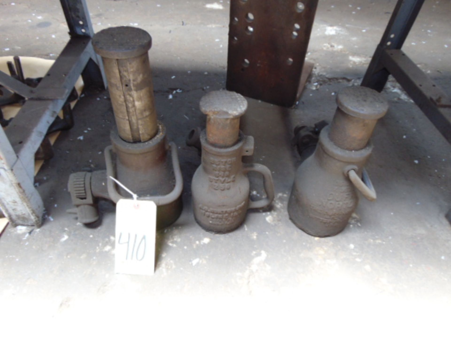 LOT OF BOTTLE JACKS (3) (under one bench)