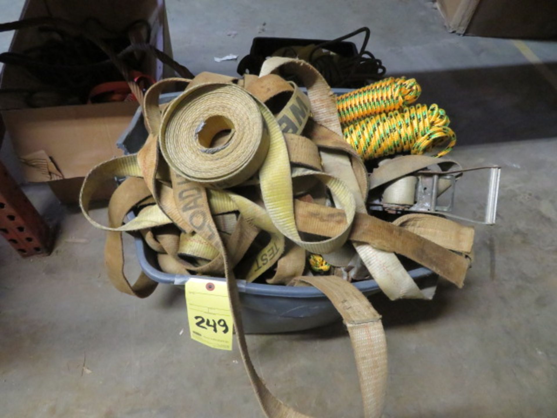 LOT CONSISTING OF: tie down nylon straps, rope, rachet straps, (three containers)