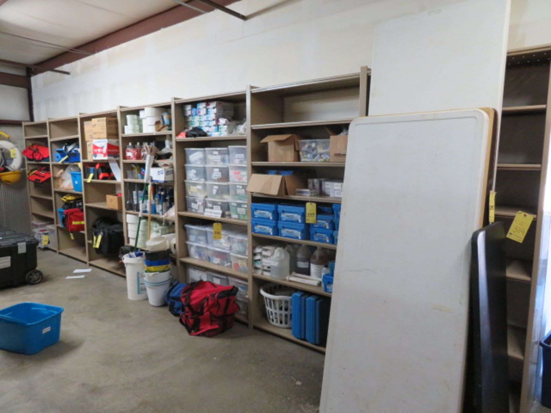 LOT OF METAL STORAGE SHELVING (7) sections. (Note: contents on or around shelves are not included)