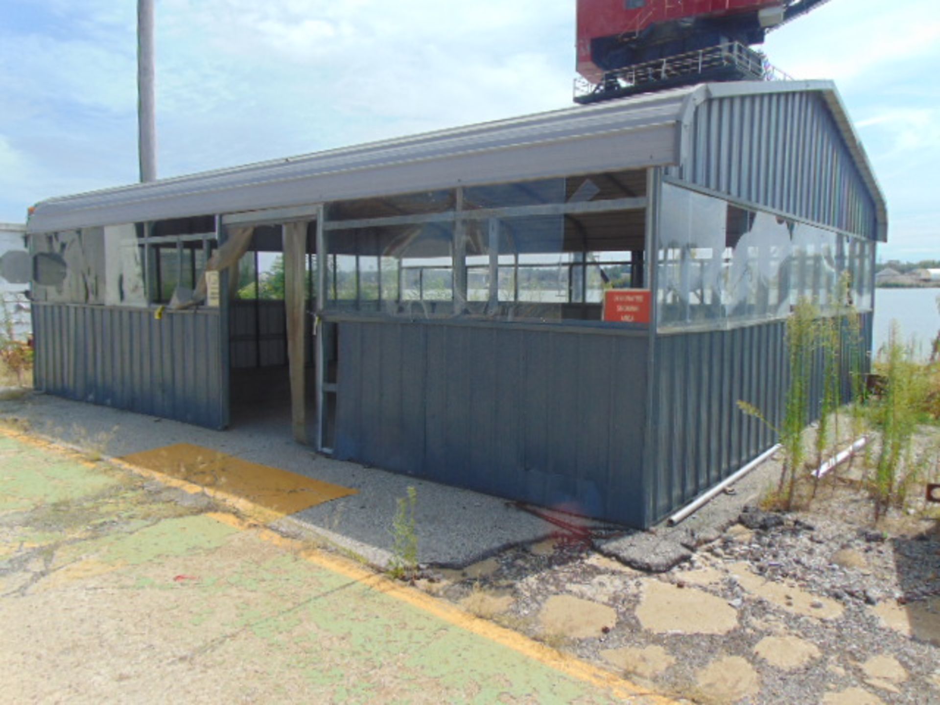 PORTABLE PREFABRICATED METAL BUILDING, 24'W. x 30'L., 10' center ht., corrugated paneling,