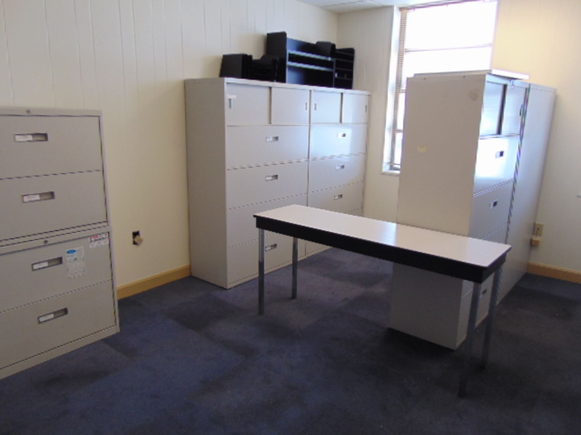 LOT CONSISTING OF: (6) lateral file cabinets, (3) 2-door supply cabinets & table (located upstairs)