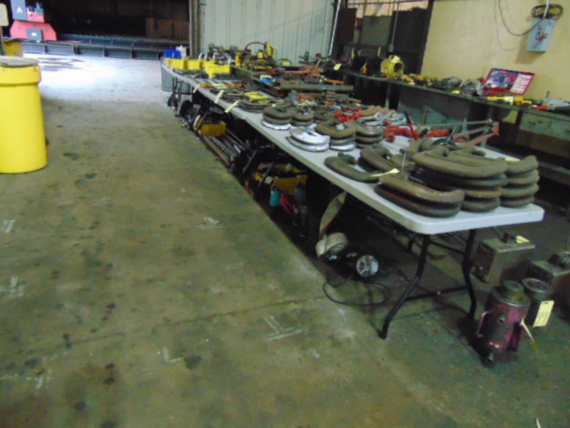 LOT CONSISTING OF: (4) folding leg tables, (3) steel workbenches (cannot be removed until contents