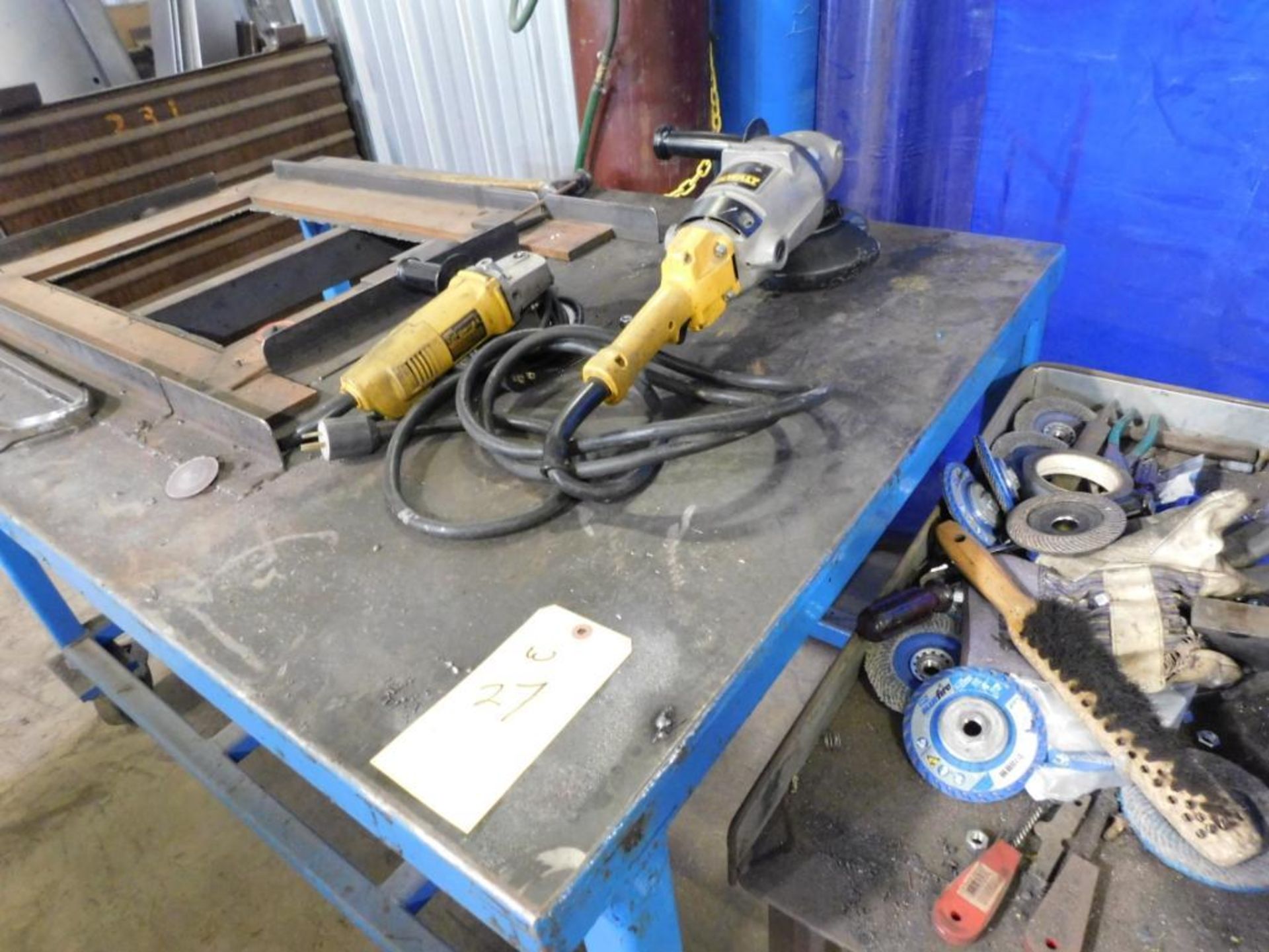 LOT CONSISTING OF: cabinet, (2) rolling tables, w/contents of welding supplies, (2) DeWalt angle