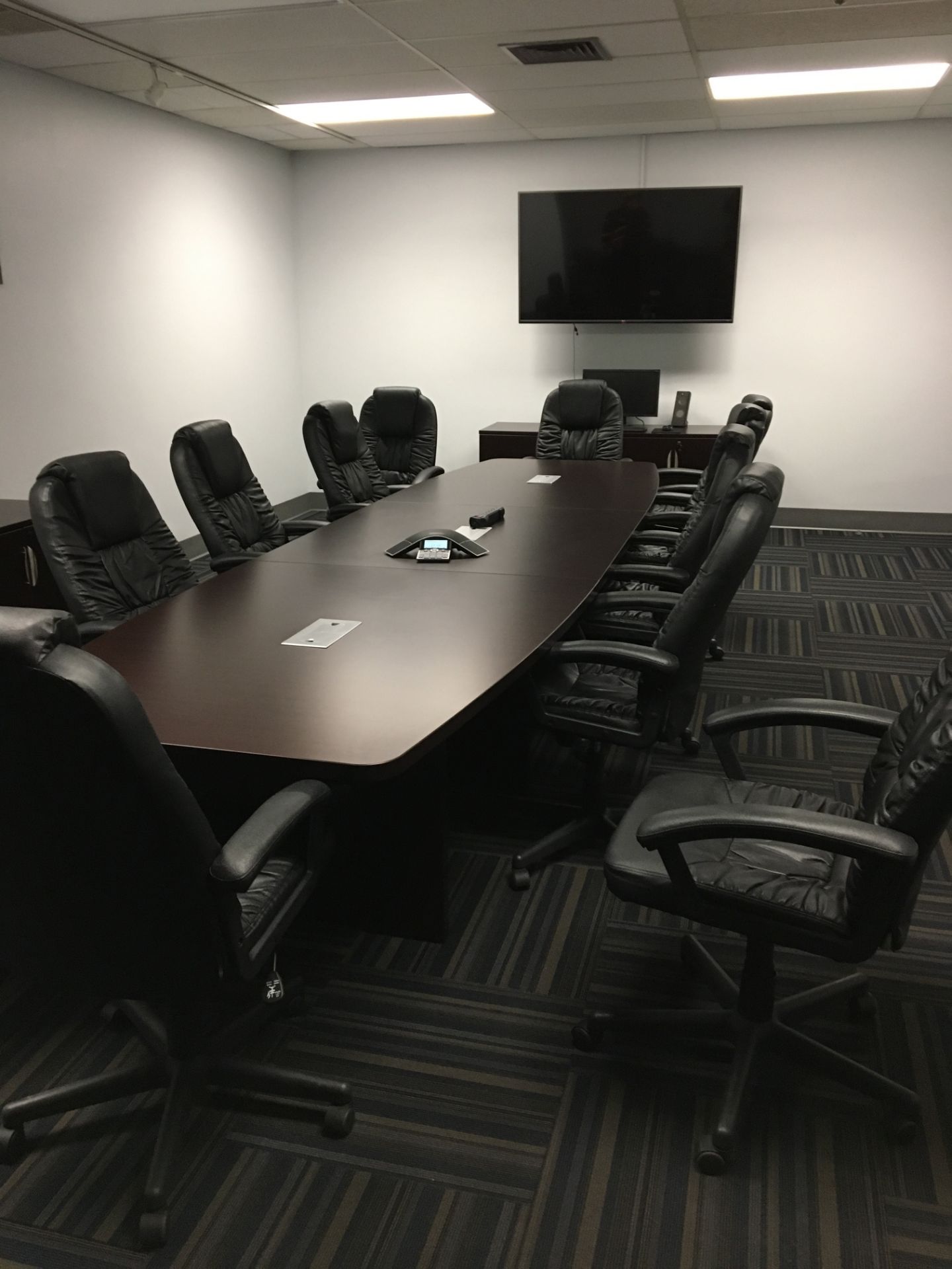 LOT: Contents of Conference Room includes, Conference Table, Chairs, Cabinets, TV