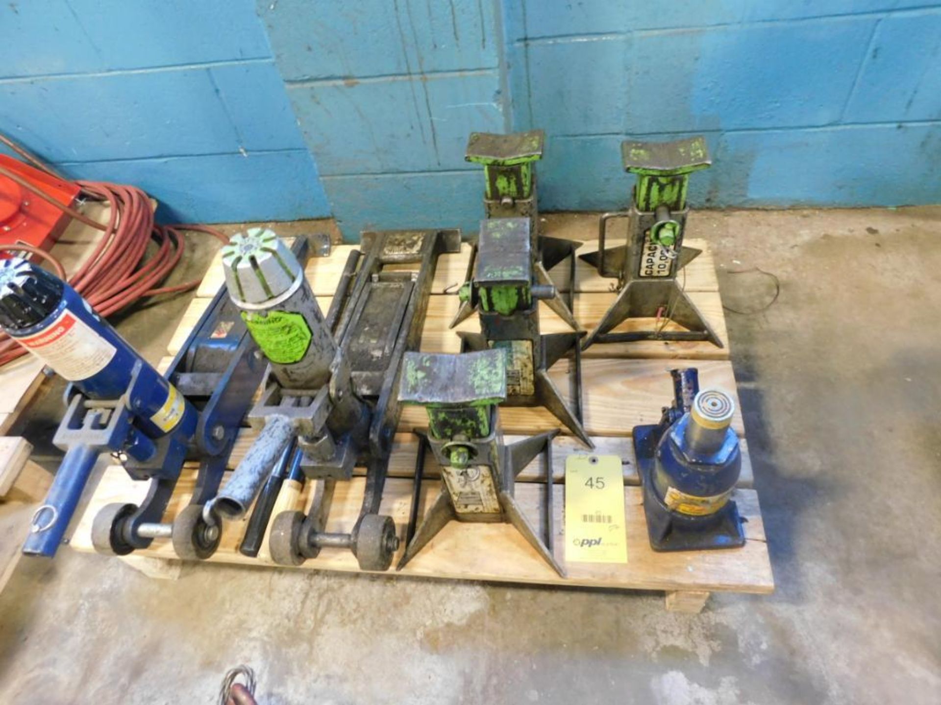 LOT: (2) 4 Ton Floor Jacks, (4) Jack Stands, (1) Bottle Jack