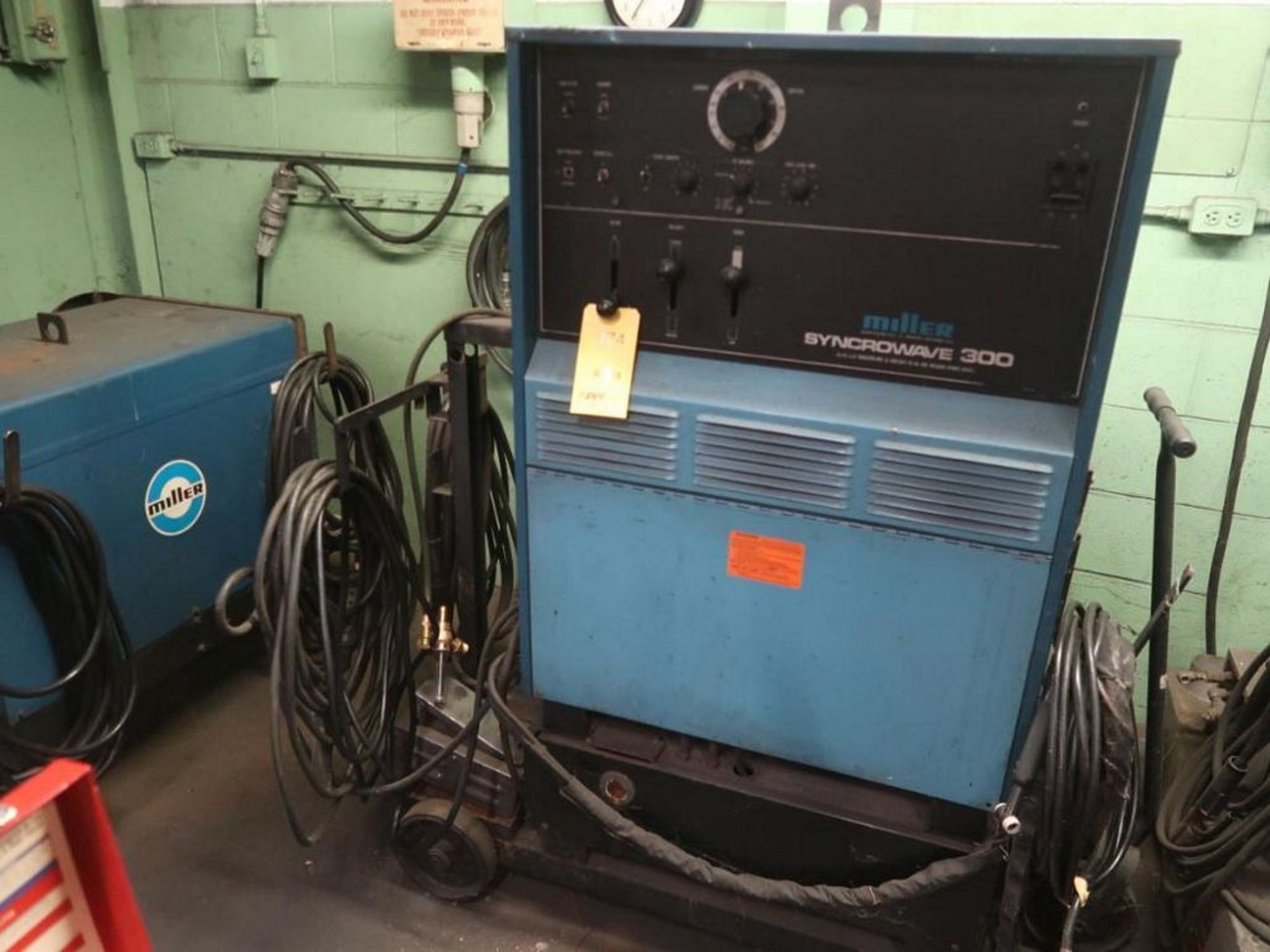 Miller 300 Amp DC Welding Power Source Model Syncrowave 300, S/N JC630260, with Leads, Guns, Cart