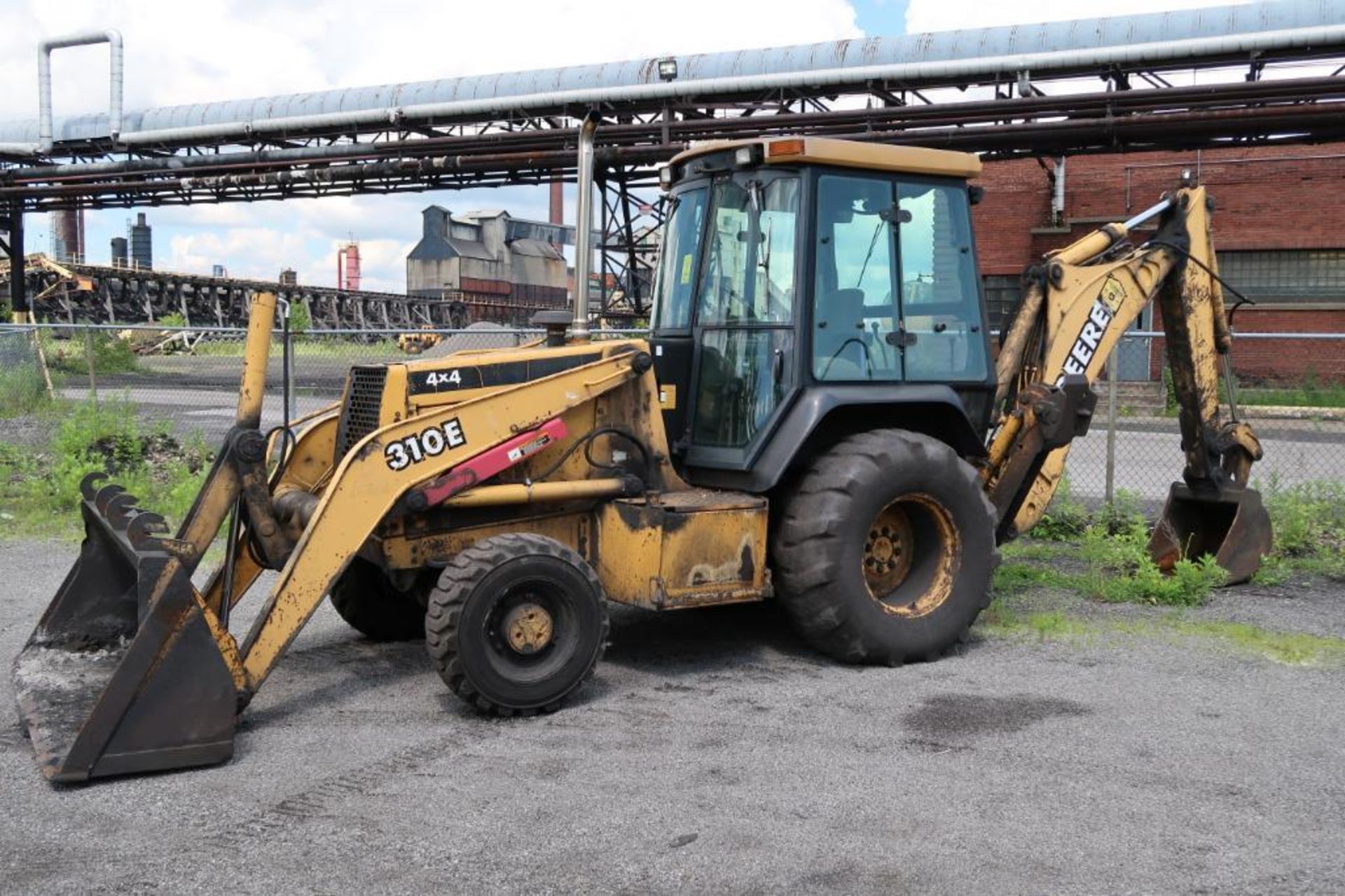 John Deere 4x4 Loader Backhoe Model 310E, S/N T0310EX890469, Air Conditioned Cab, Outriggers, 85 in.