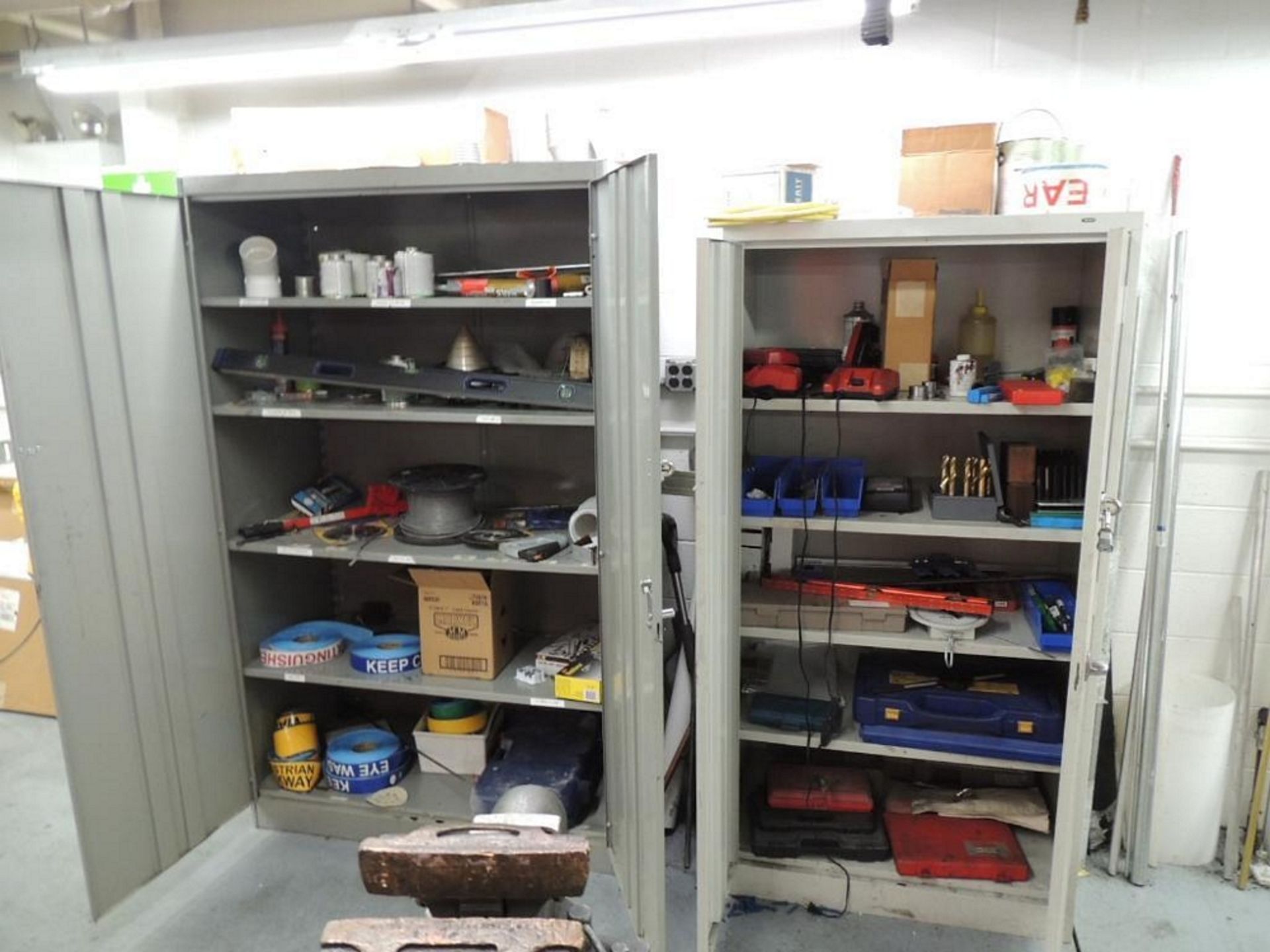 LOT: (3) Storage Cabinets W/ Misc. Tools, Tap and Dies Sets, Milwaukee Chargers, Levels, Lubricants,