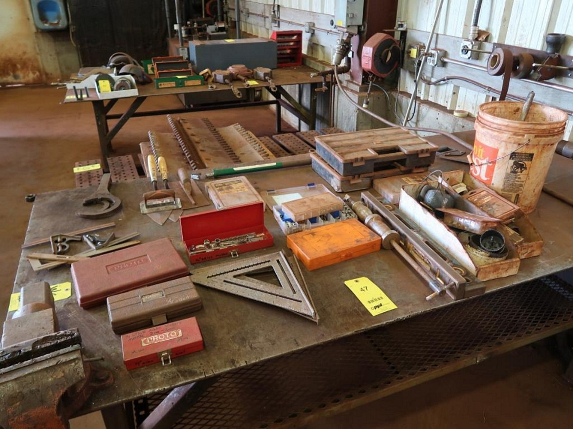 LOT: Contents on Table including Trowels, Squares, Hole Saws, Levels, Grease Zerks (no table or vise