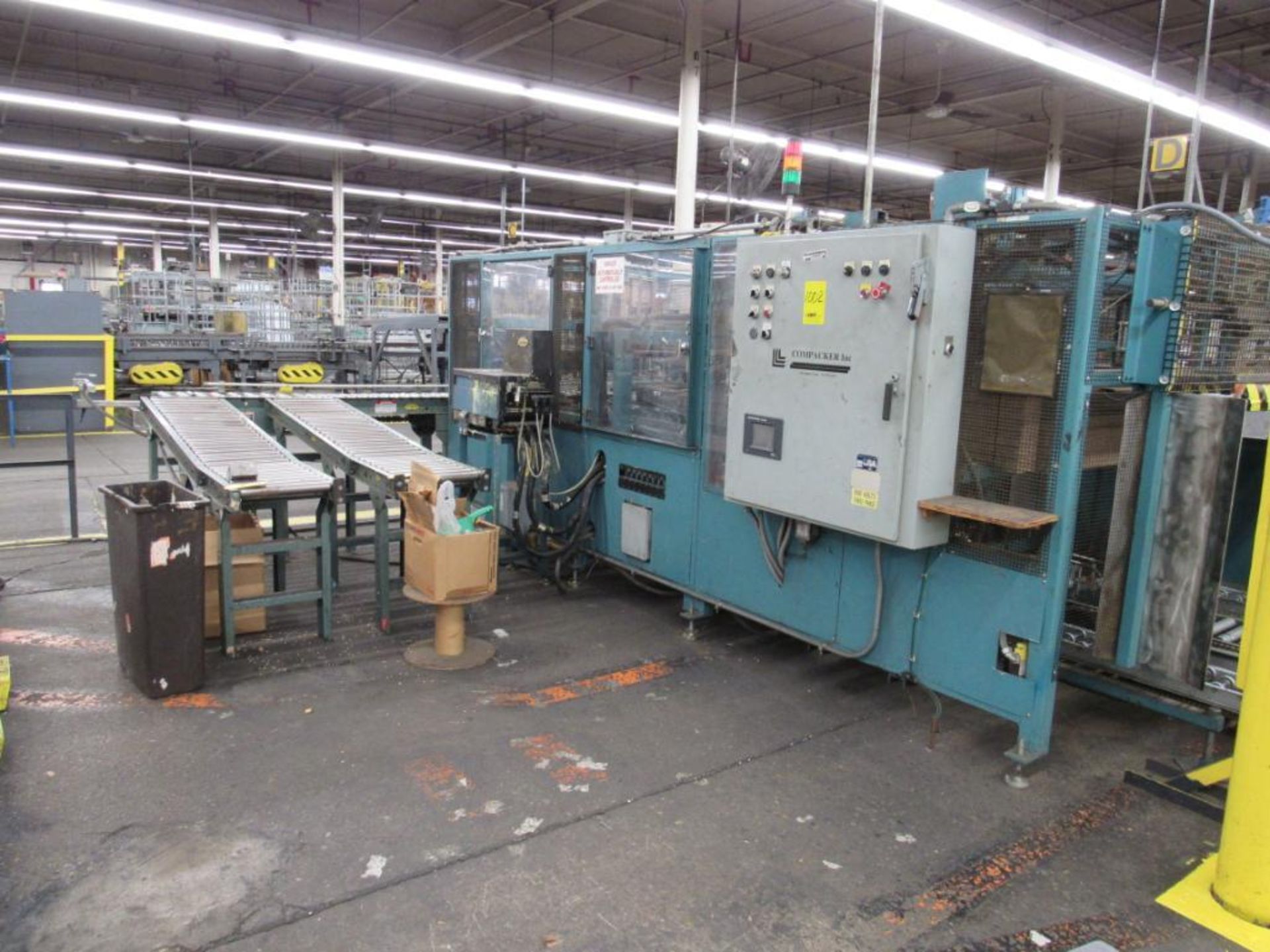 LOT: Packaging Line #D including: (1) Compacker Carton/Case Sealer Model RATUP1003, S/N 100399032, w