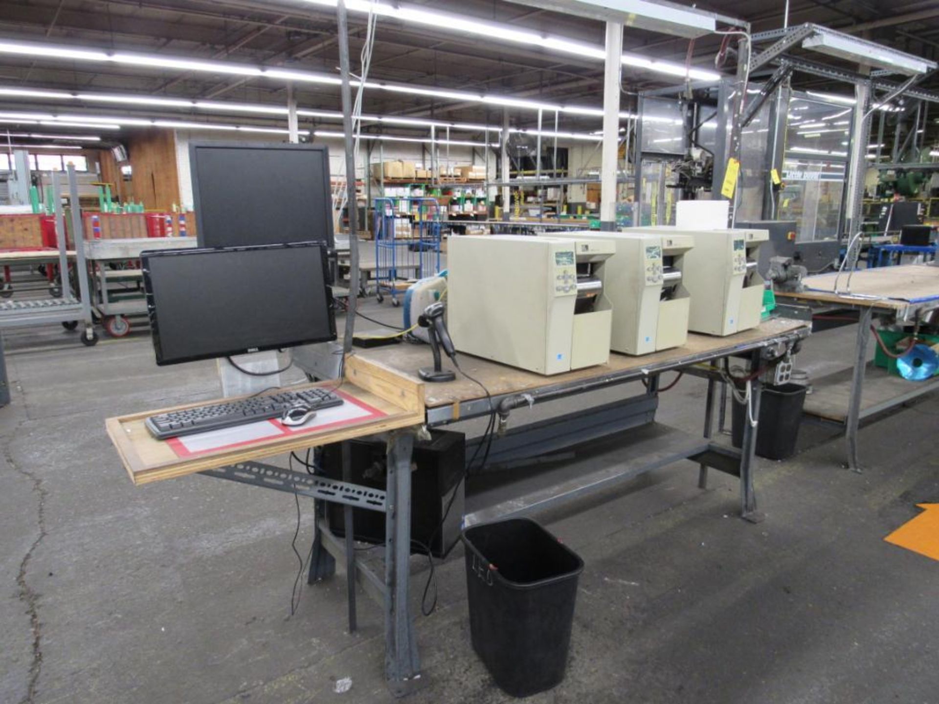 LOT: Label Line including: (3) Zebra 105SL Plus Label Makers (3) 36 in. x 72 in. Work Benches - (1)