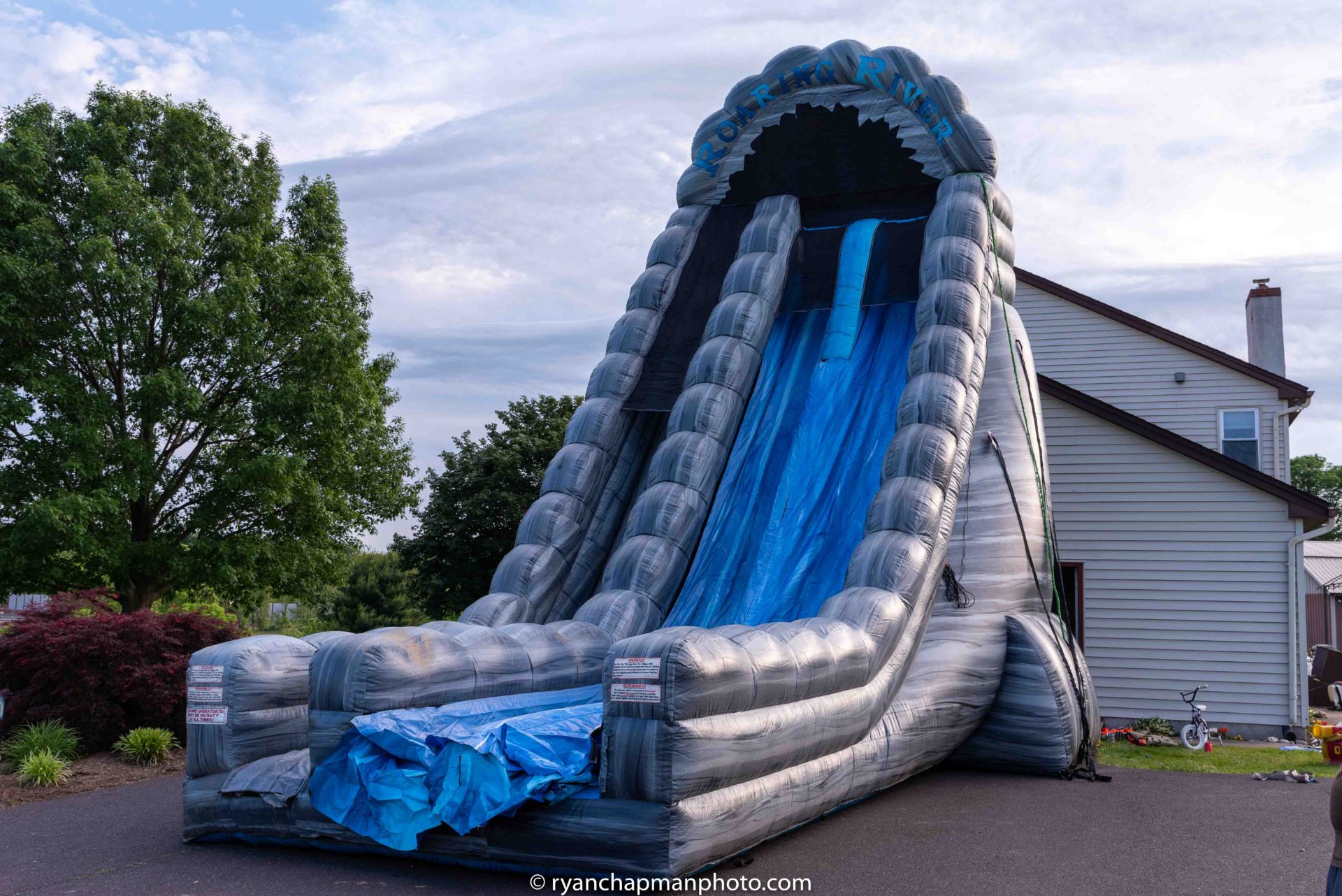 ROARING RIVERS CURVED SLIP-N-SLIDE INFLATABLE - (LOCATED AT TELFORD, PA)