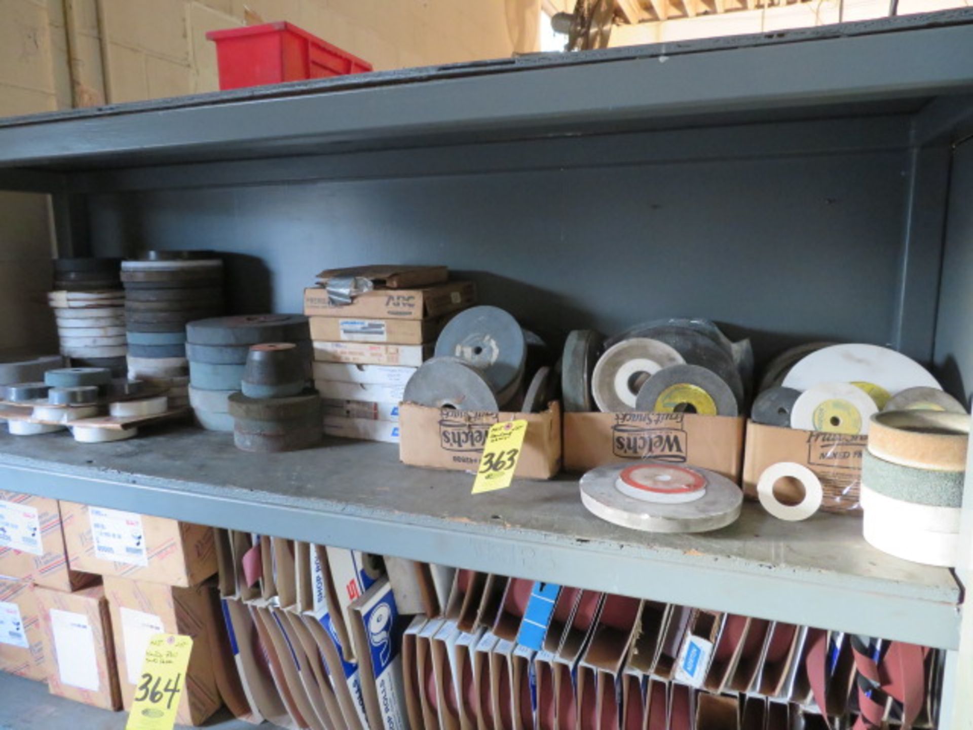 SHELF OF ASSORTED GRINDING WHEELS