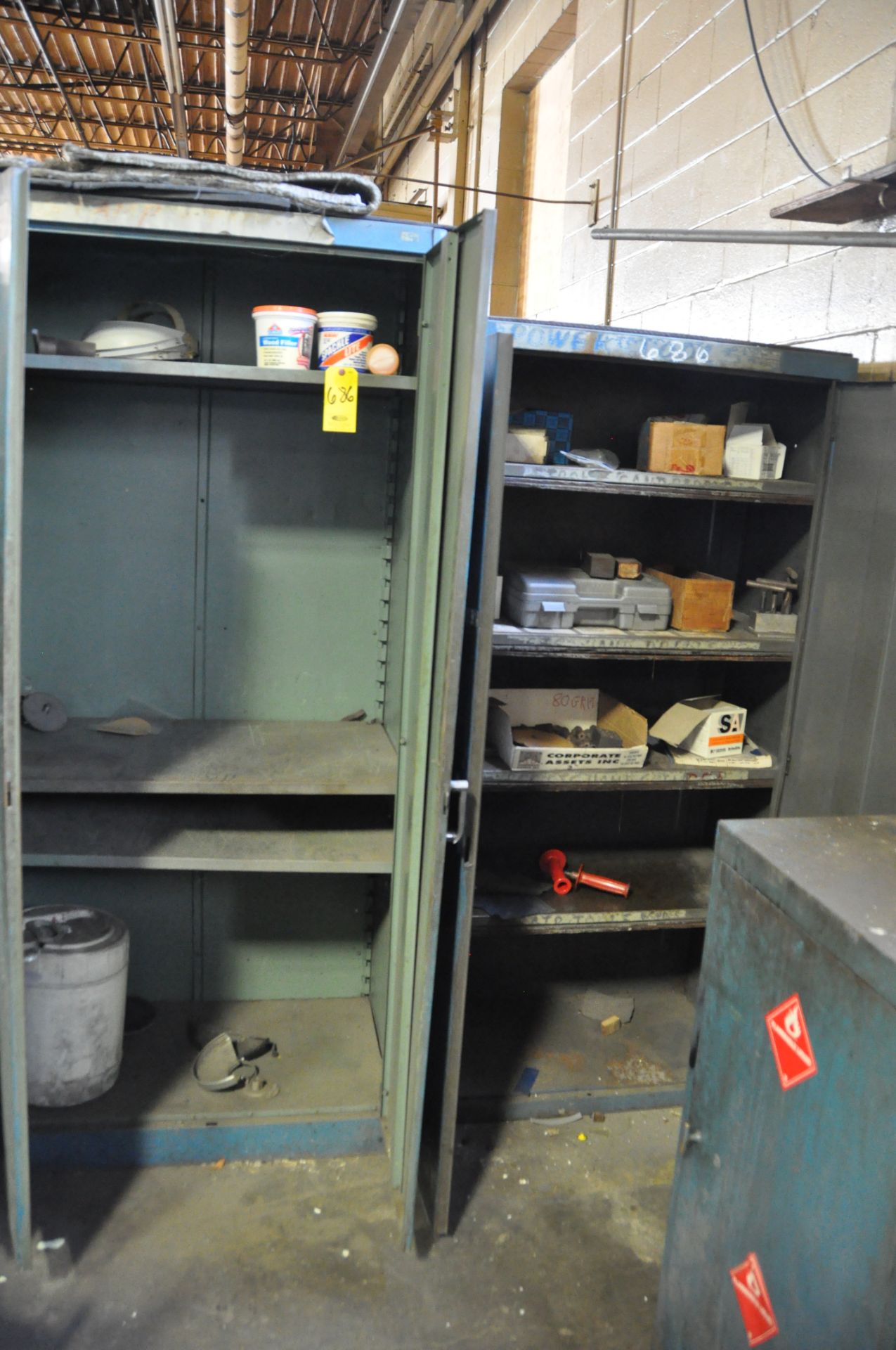 (2) METAL CABINETS WITH ASSORTED MISCELLANEOUS CONTENTS.