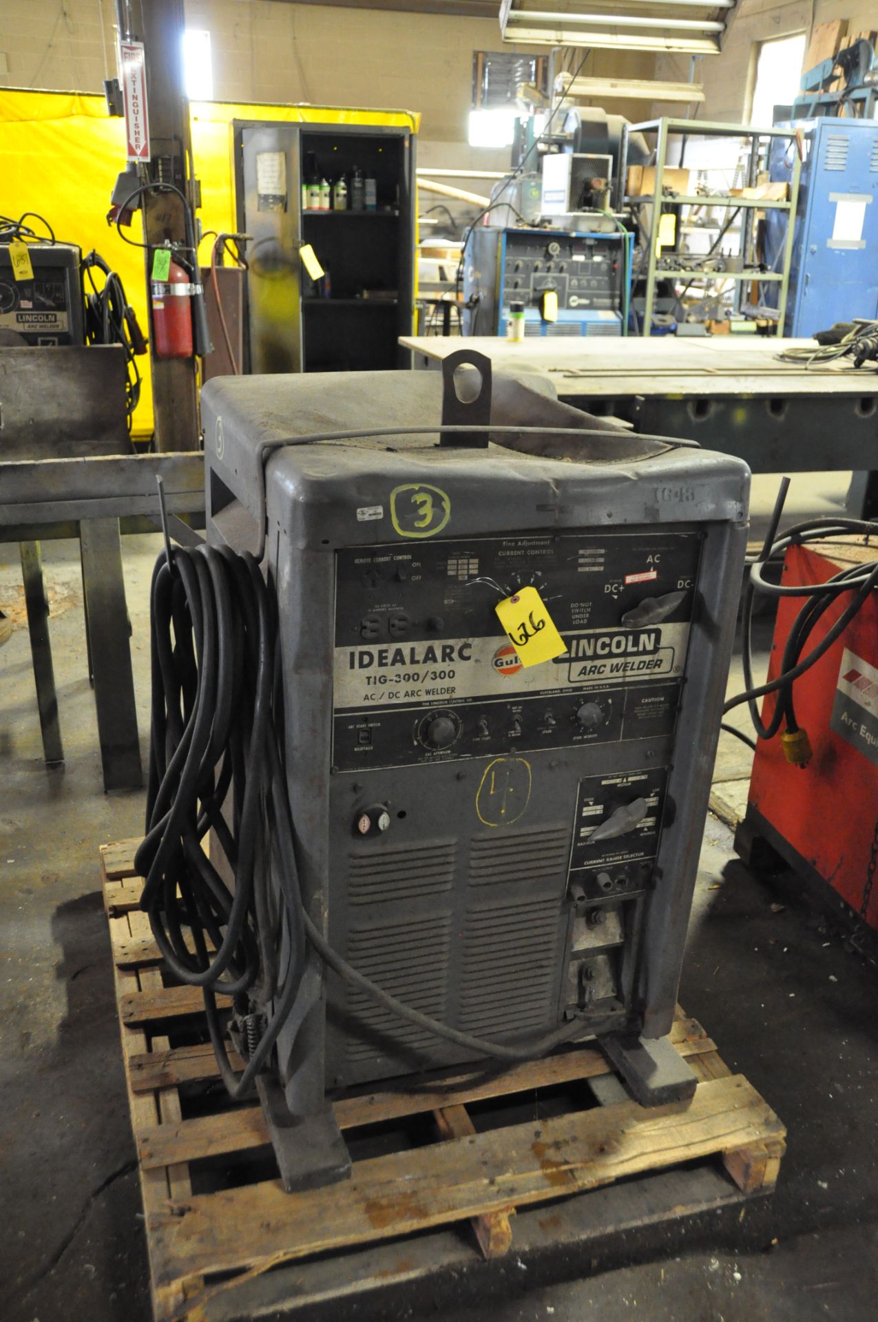 LINCOLN IDEALARC WELDER WITH GROUND CABLE.