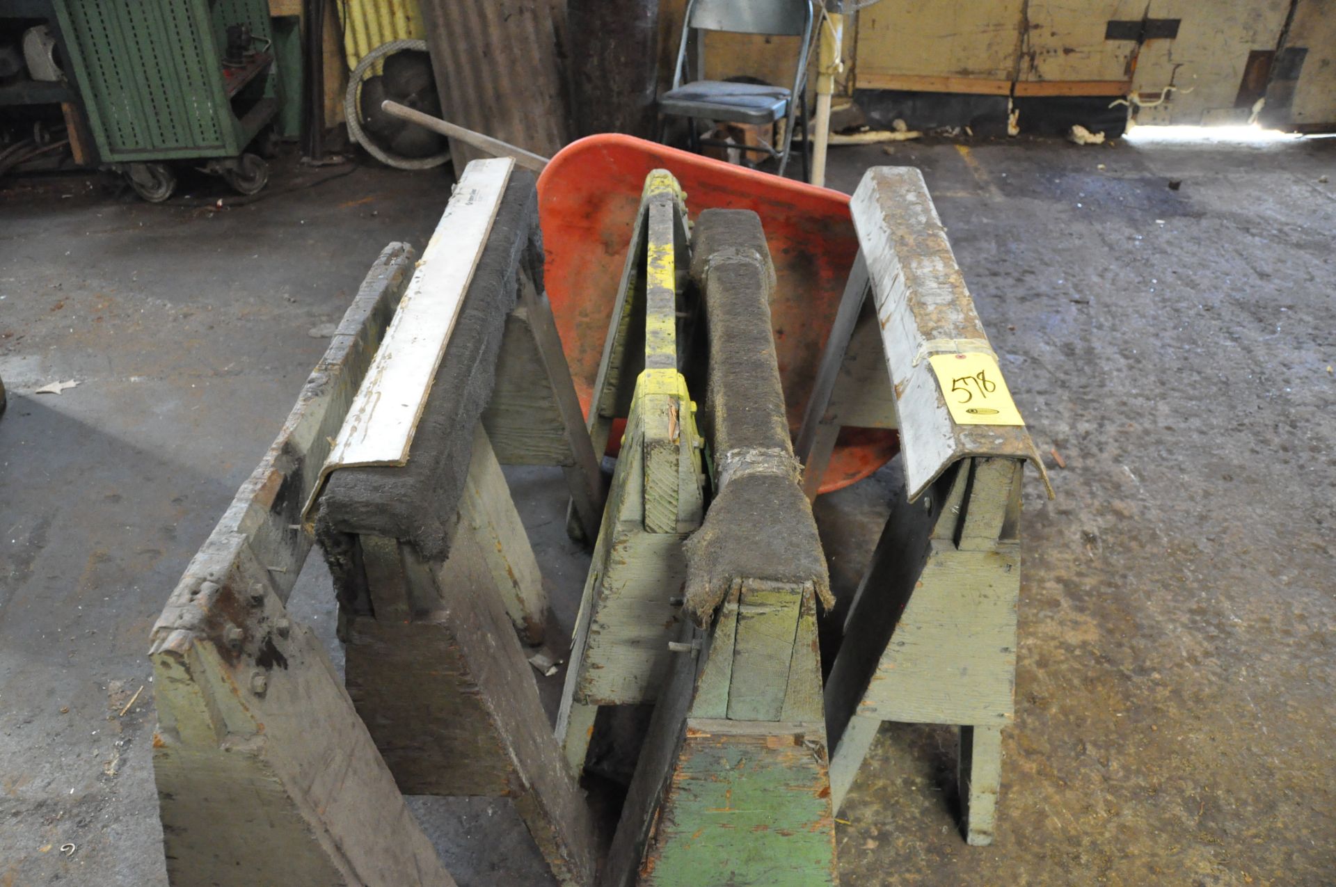 (5) ASSORTED WOOD SAW HORSES AND (1) RED WHEEL BARROW