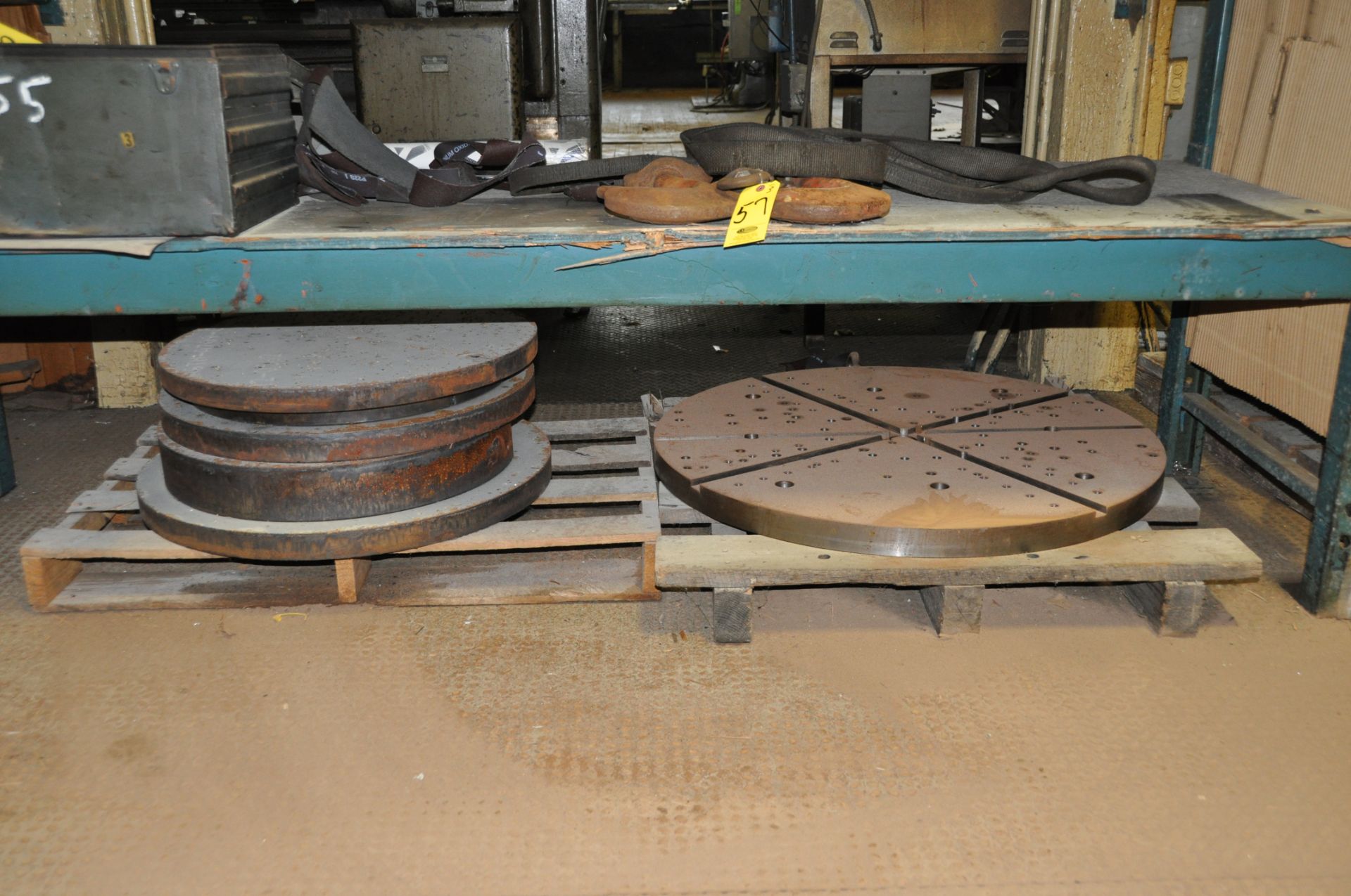 (4) SKIDS WITH ASSORTED LARGE ROUND STEEL PLATES