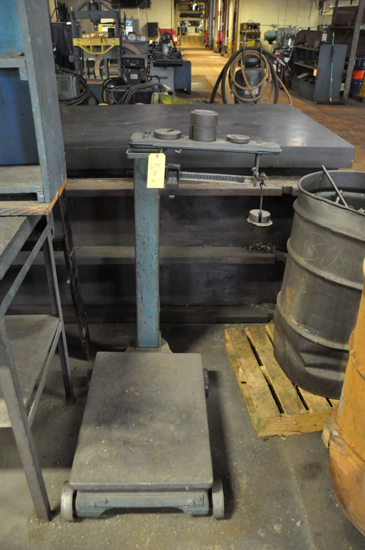 PORTABLE FLOOR SCALE AND (2) 55 GALLON DRUMS OF STEEL SCRAP.
