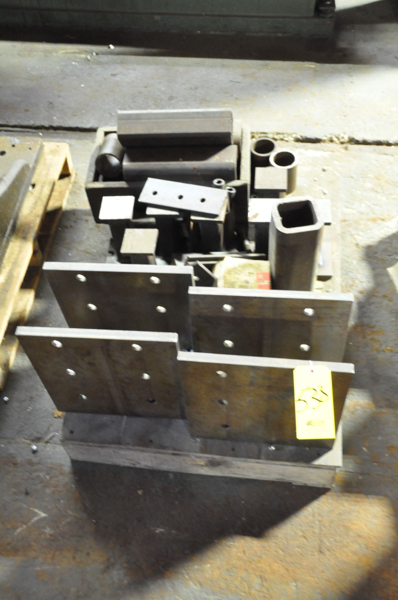 SKID WITH (4) ANGLE PLATES AND MISC. STEEL PIECES
