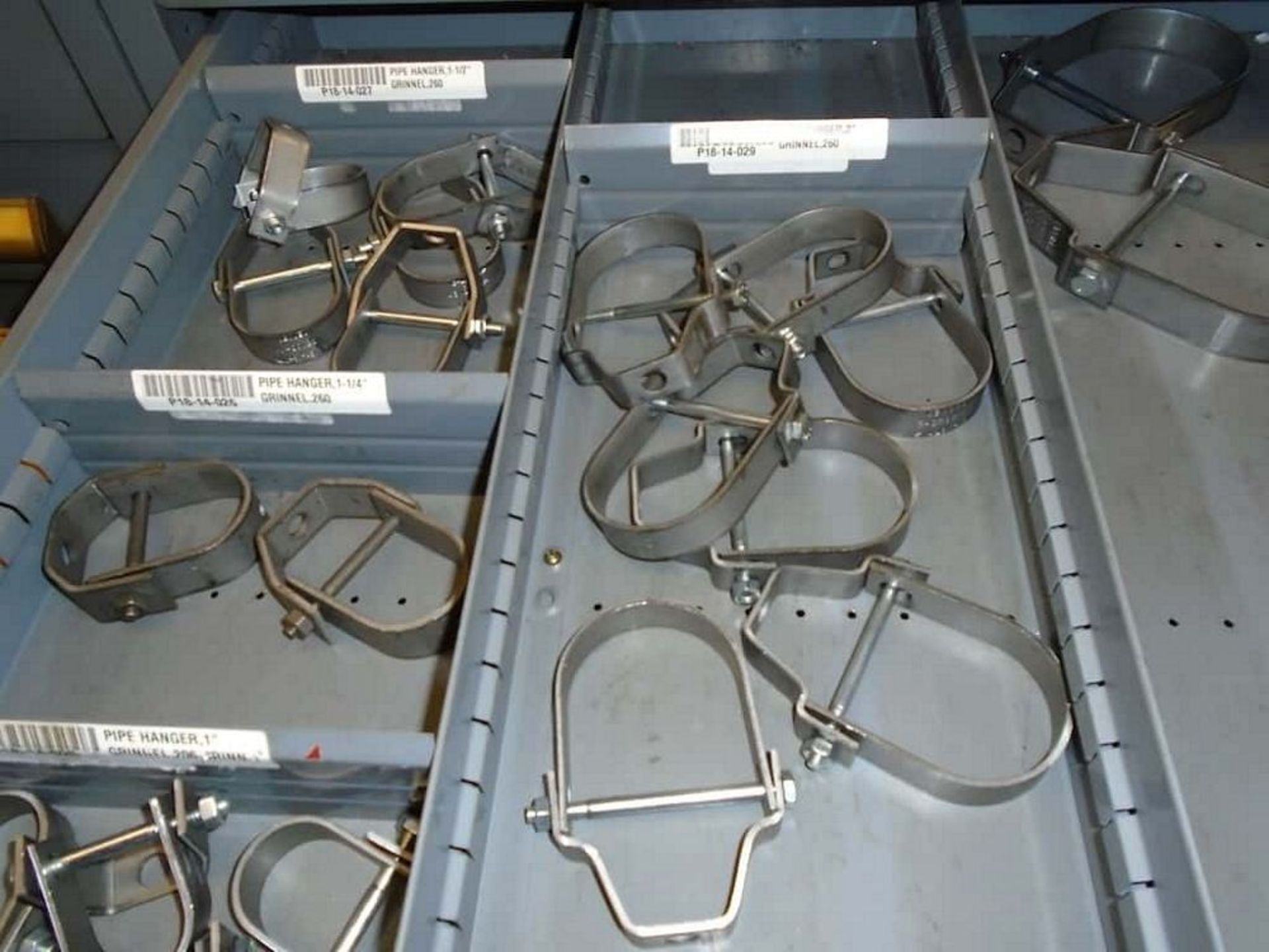 Contents of Cabinet ( Assorted Grinnell Pipe Hangers, Pipe Fittings, Gaskets)