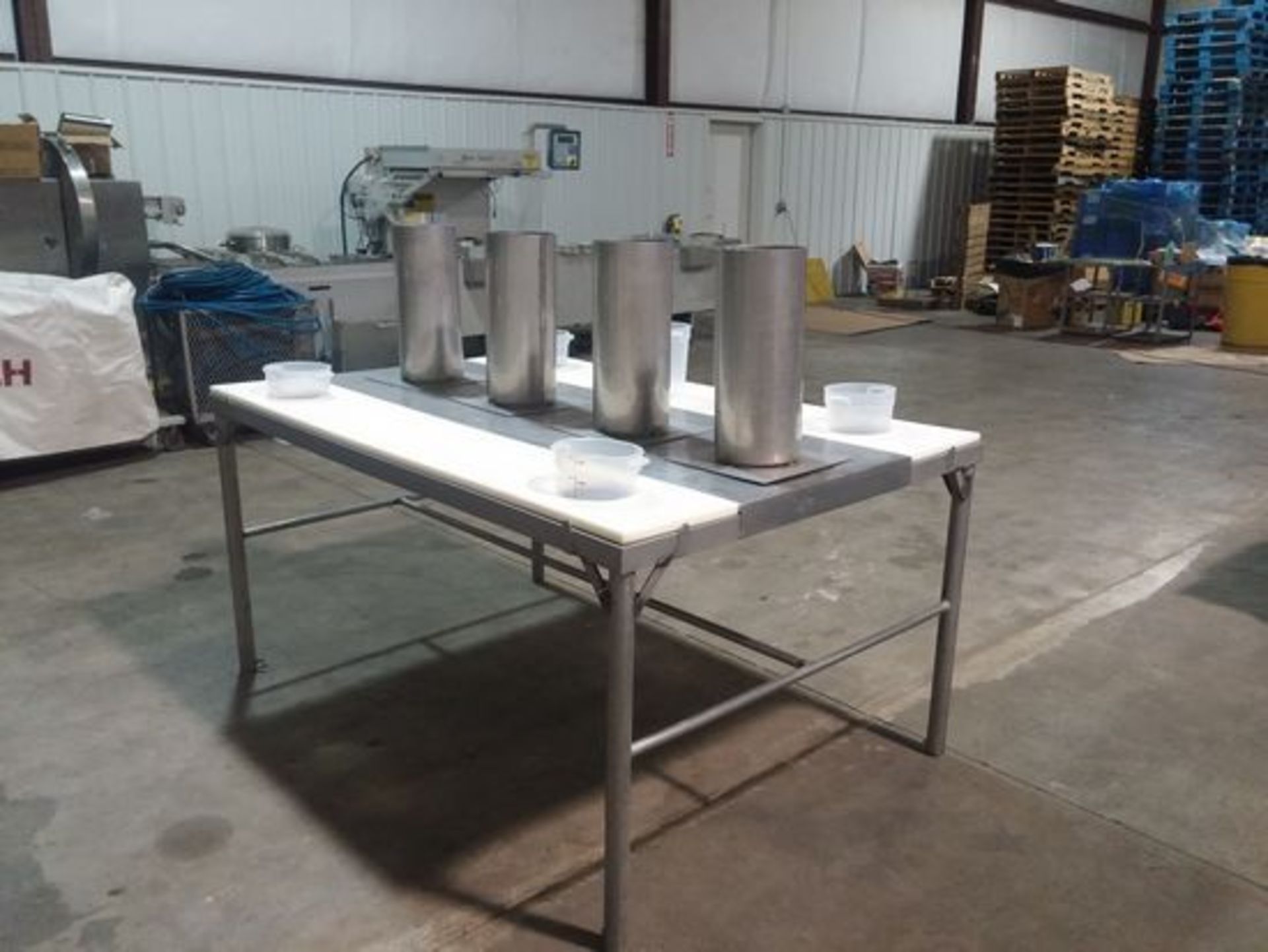 S/S trim or Bagging Table. This 6'L table has 12" cutting boards on both sides of its 48" width.