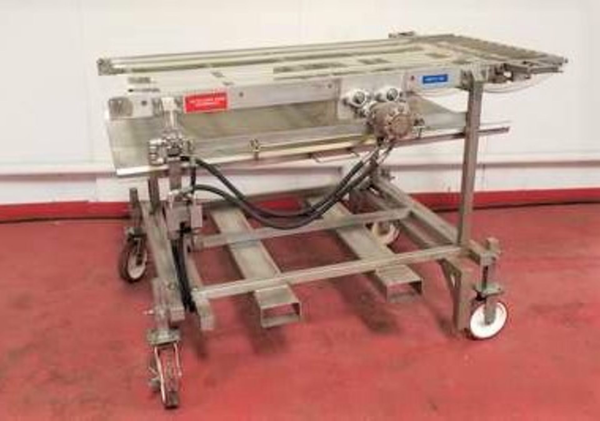 S/S Wire belt transfer conveyor. 69"L x 32" usable. S/S frame conveyor on 8" adjustable locking