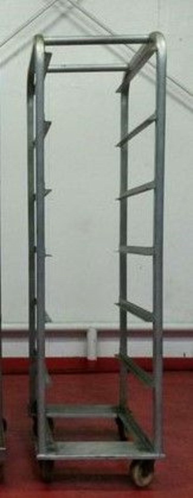 Aluminum Bakers Rack. On casters. 7-pan design. 9.75" spacing between racks. OD = 19.5 "x 26.75" x