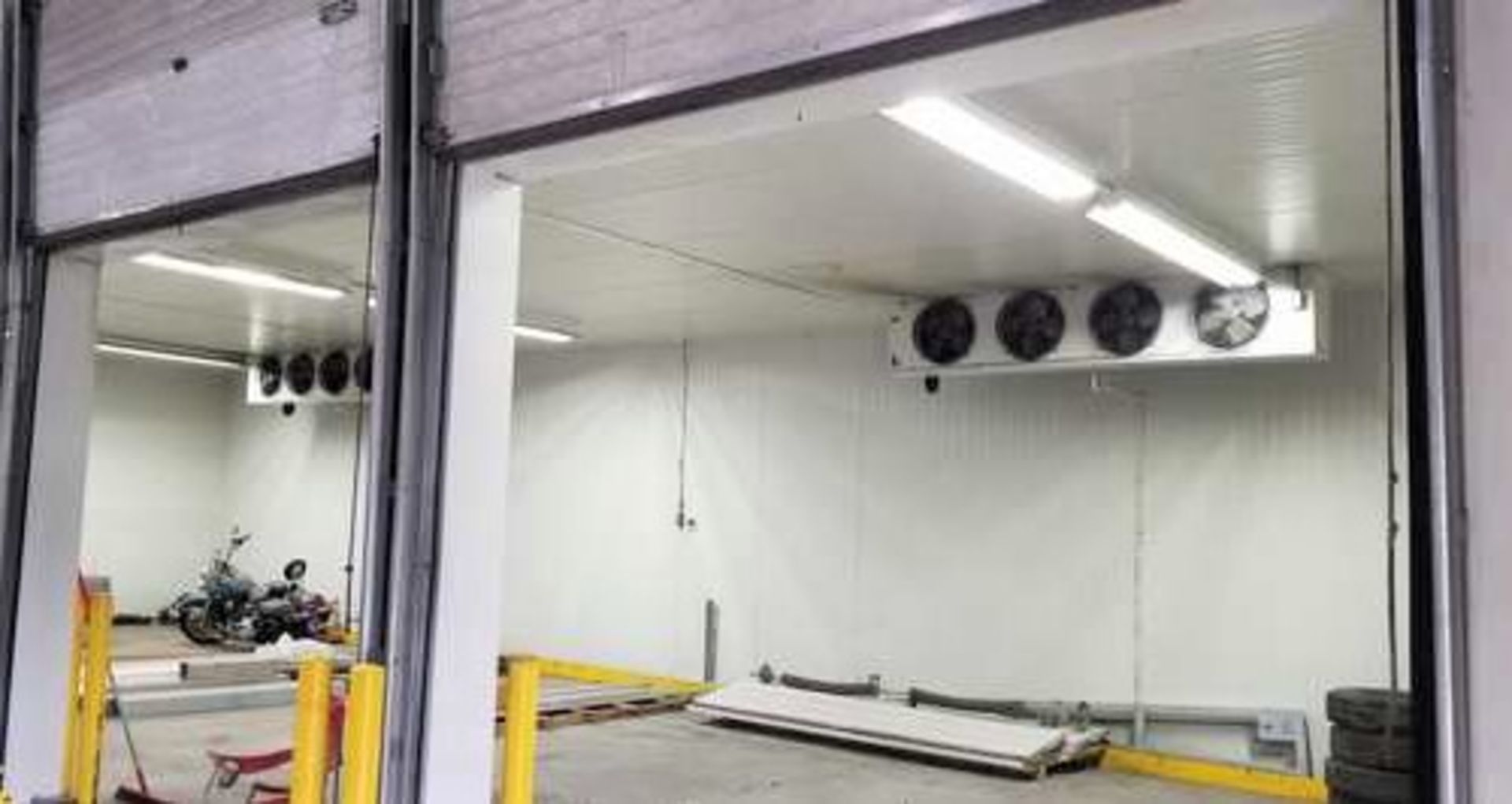 24' x 60' cooler, complete with freon compressor and evaporator blowers. Cooler has 12' high