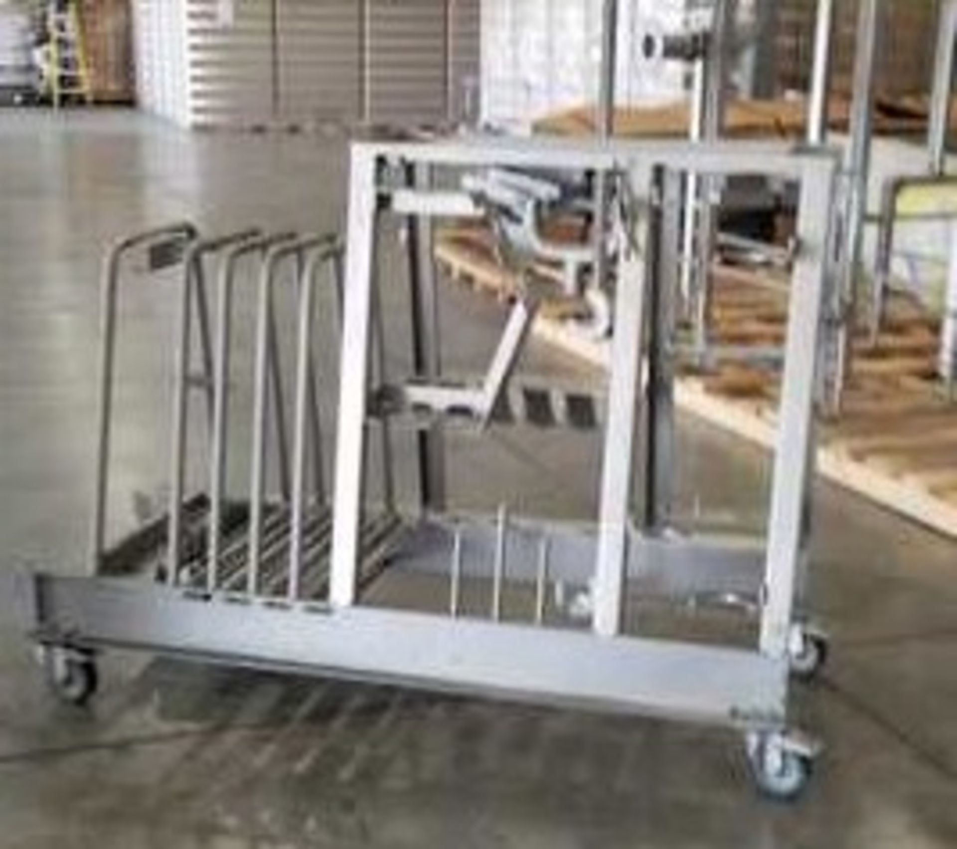 S/S Injector parts stand. On castors. OD = 72" x 32" x 35"H. Offered AS IS. Location: San Antonio,