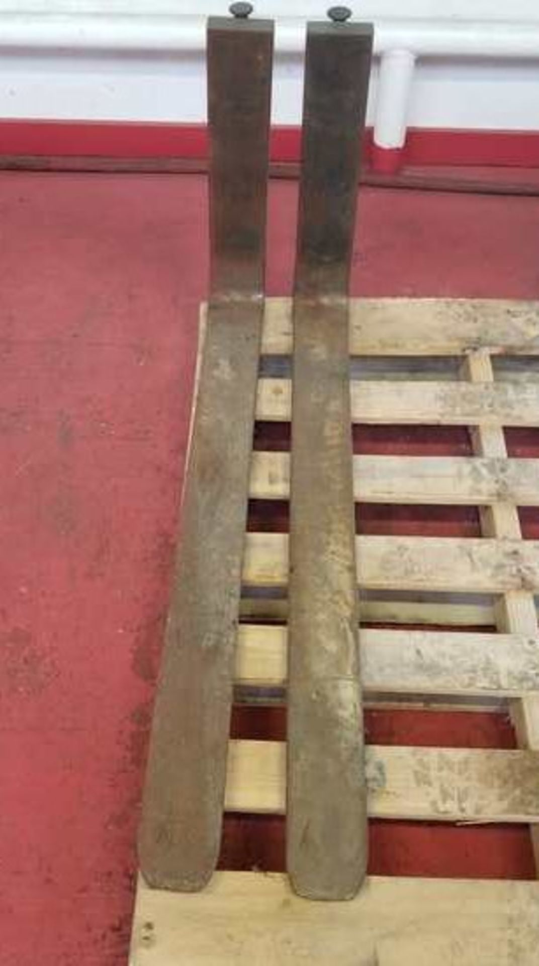 40"L x 4"W forks for forklift. With locking detents. Slide on to bars with 16" spacing. Good