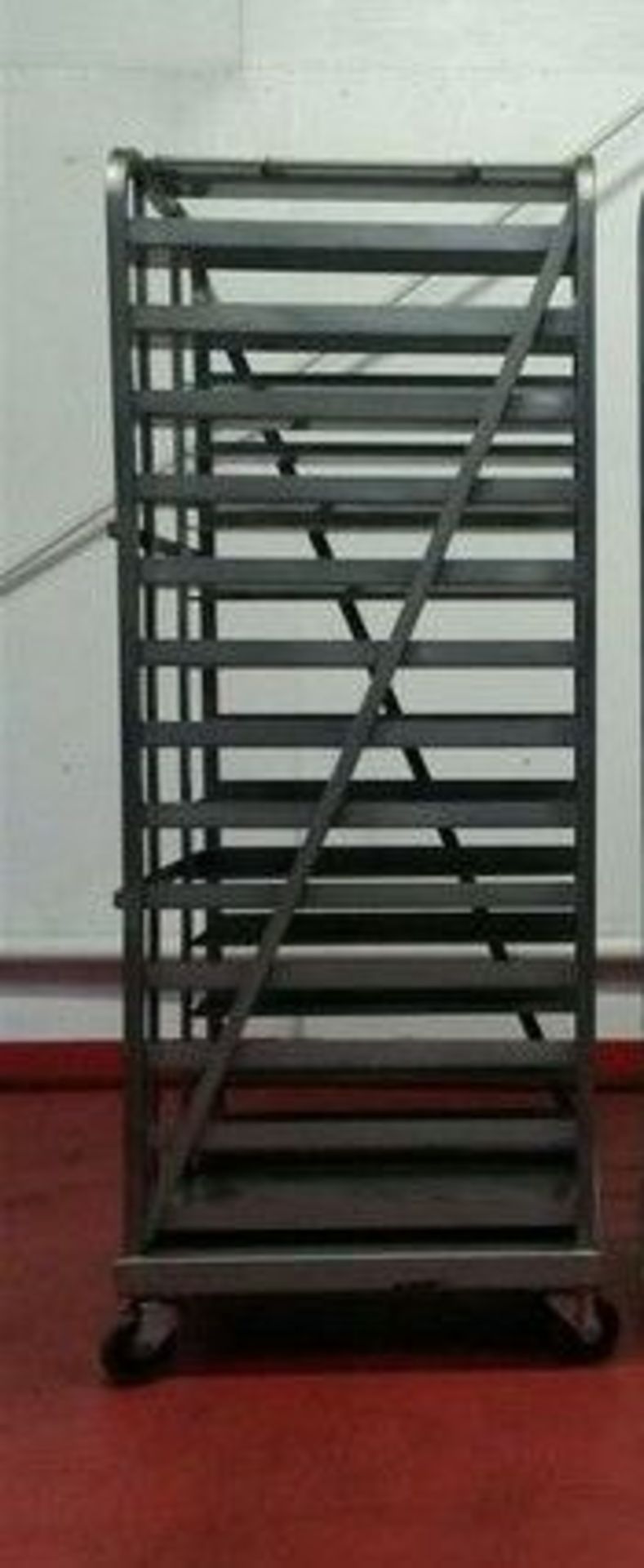 Stainless Bakers Rack.  On casters. 13-pan design. 4.5" spacing between racks. OD =  24.5" x 27" x