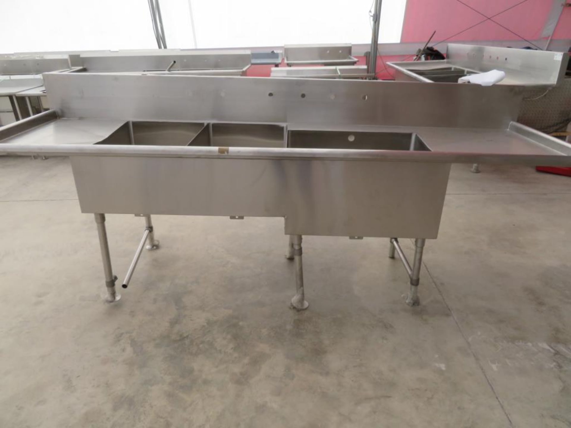 3 compartment sink, 2-20"x30"bowls, 1-30 1/2" x 24" bowl with 18" left drainboard and 26" right