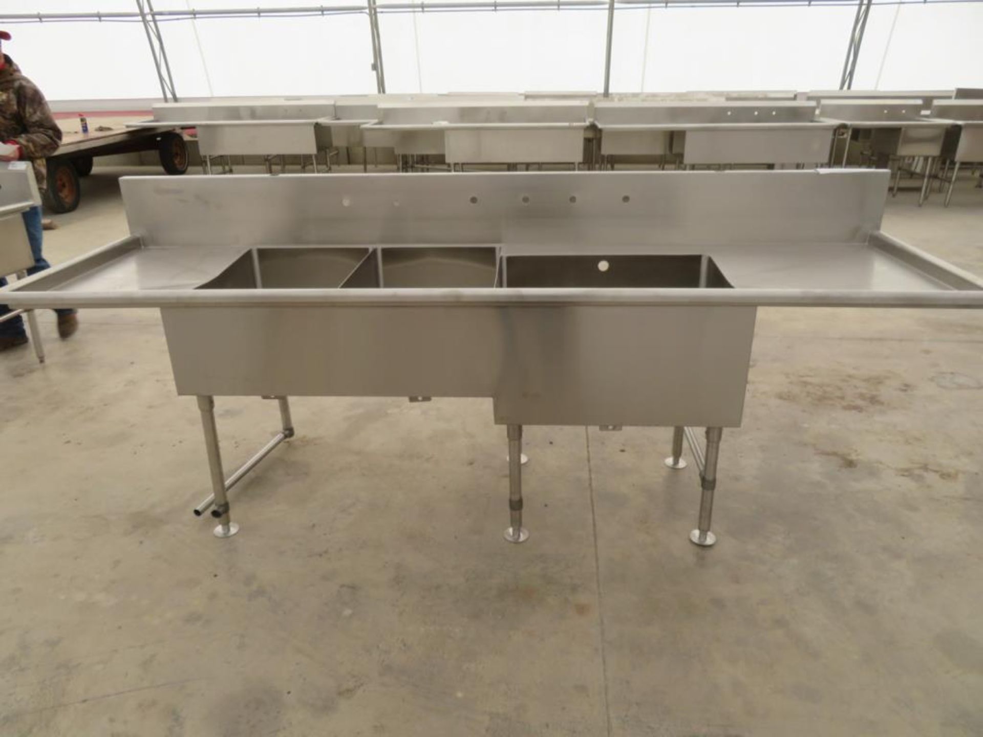 3 compartment sink, 2-20"x30"bowls, 1-30 1/2" x 24" bowl with 18" left drainboard and 26" right