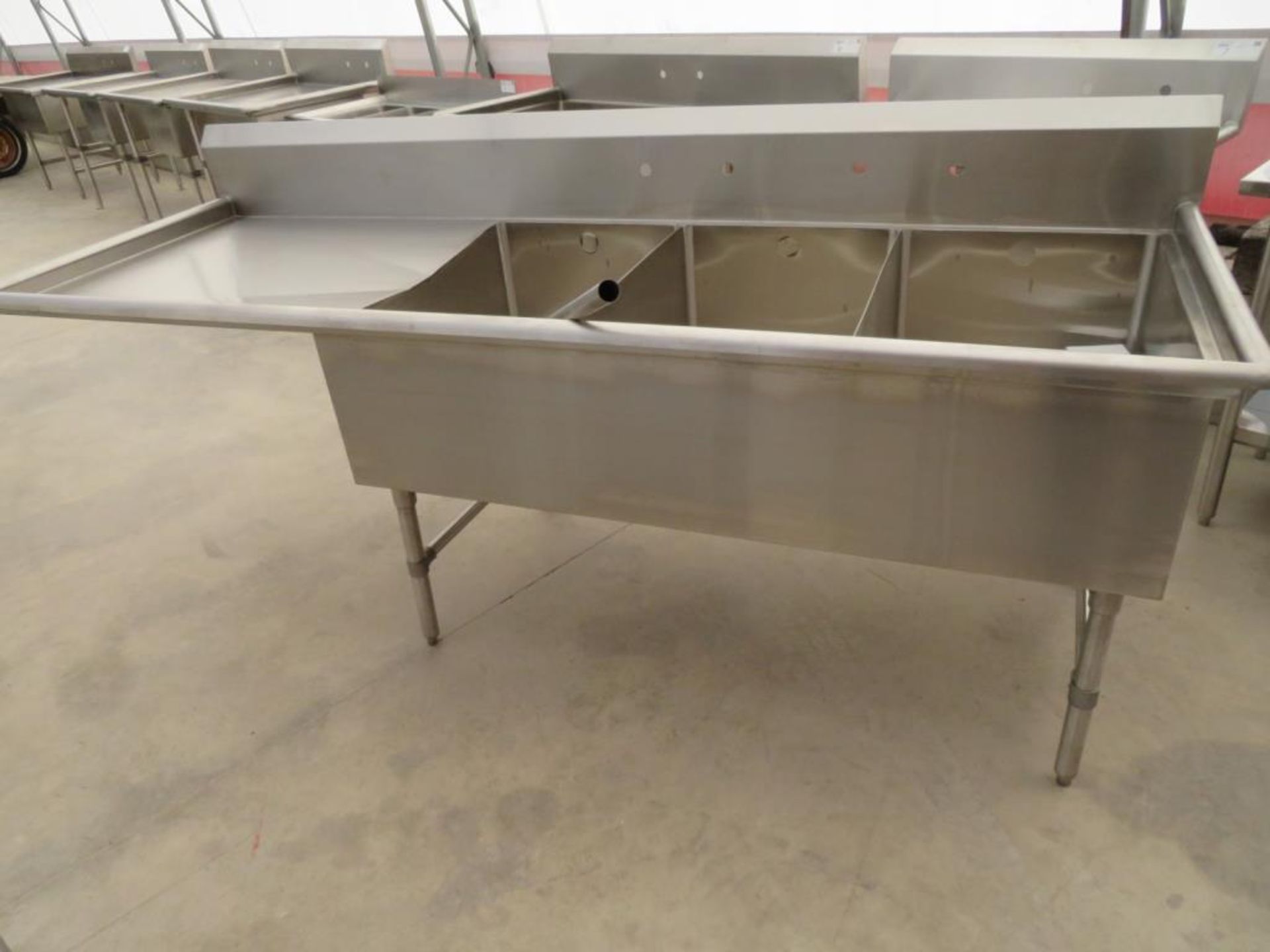 3 compartment sink, 3-20"x30" bowls with 2" overflow holes with 24" drainboard left