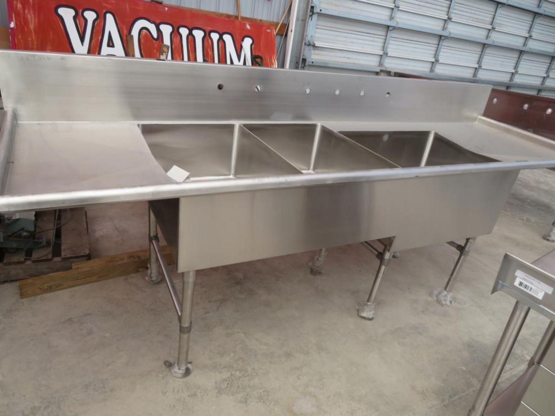 3 compartment sink, 2-20"x30"bowls, 1-30 1/2" x 24" bowl with 18" left drainboard and 26" right