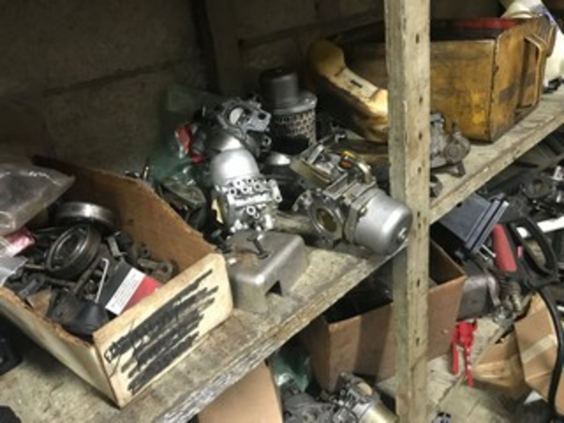 LOT RACKING WITH MOWER, TRIMMER & CHAIN SAW PARTS - CARBURETORS, TIRES, SPARK PLUGS & MORE - Image 6 of 8