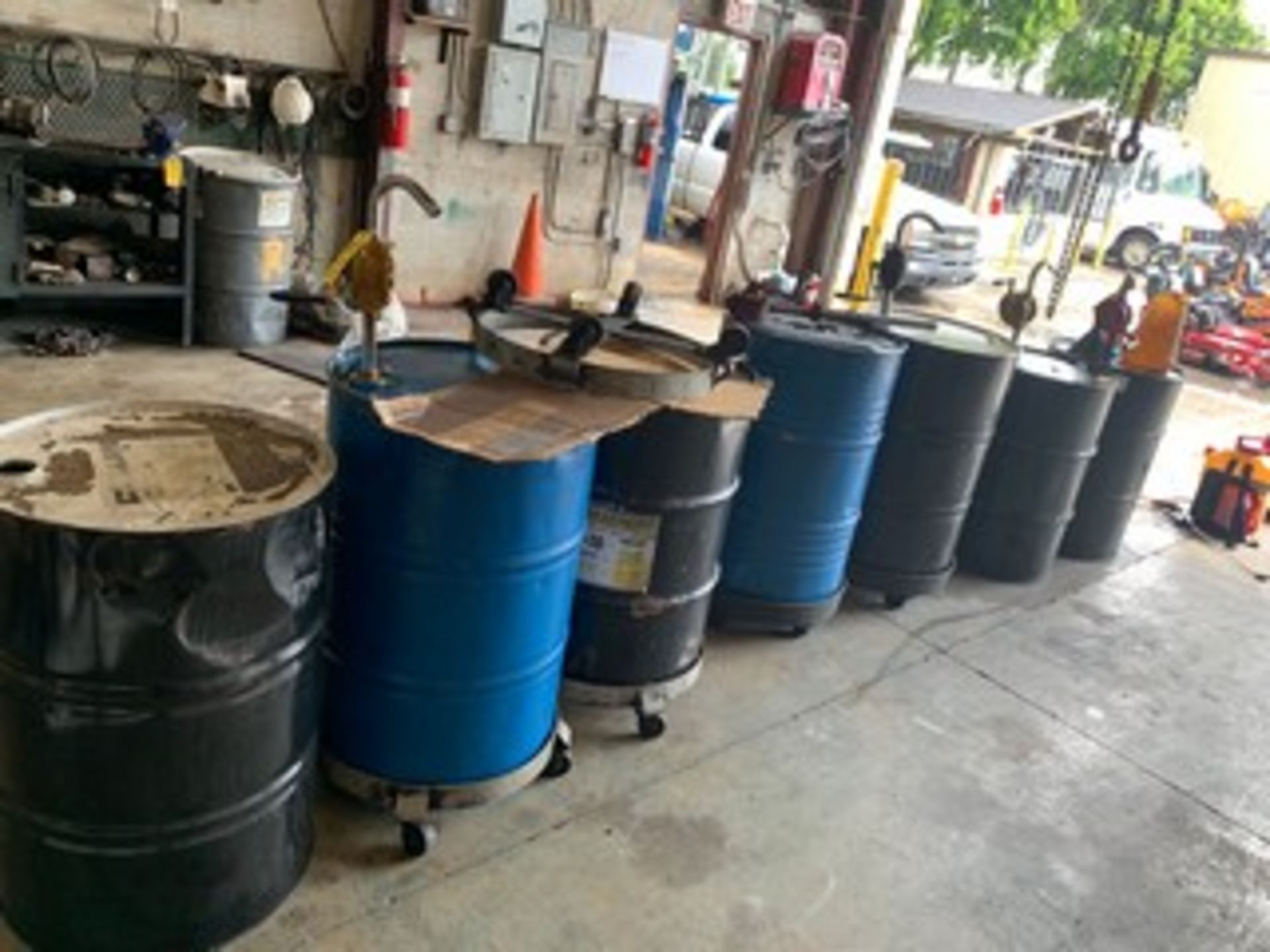 ASSORTED 55 GALLON BARRELS WITH PUMP & DOLLIES