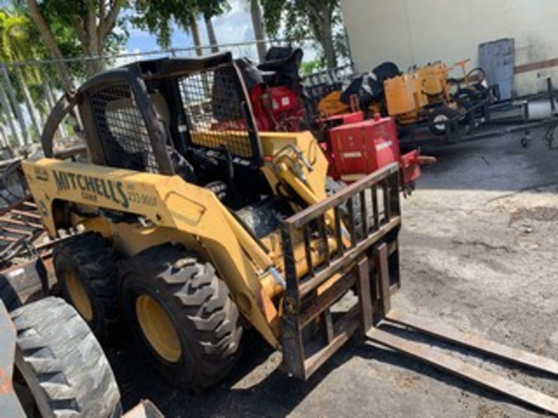 JOHN DEERE BOBCAT WITH FORKS - 2580 HOURS