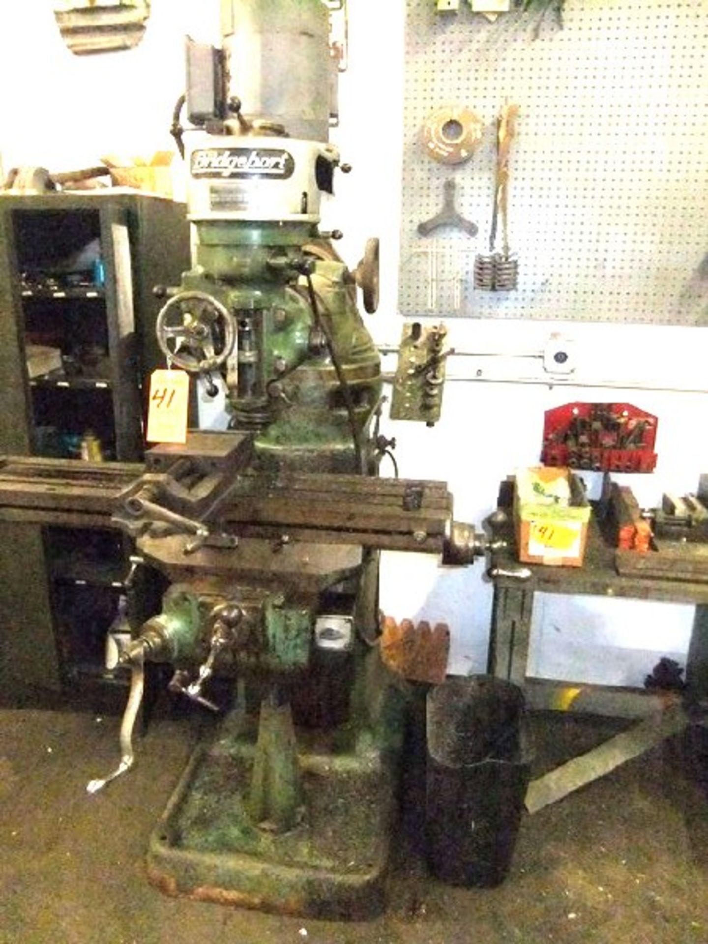LOT: BRIDGEPORT ROUND OVERARM MILL MDL J, 1 HP HEAD W/ TABLE & CABINET W/ CONTENTS