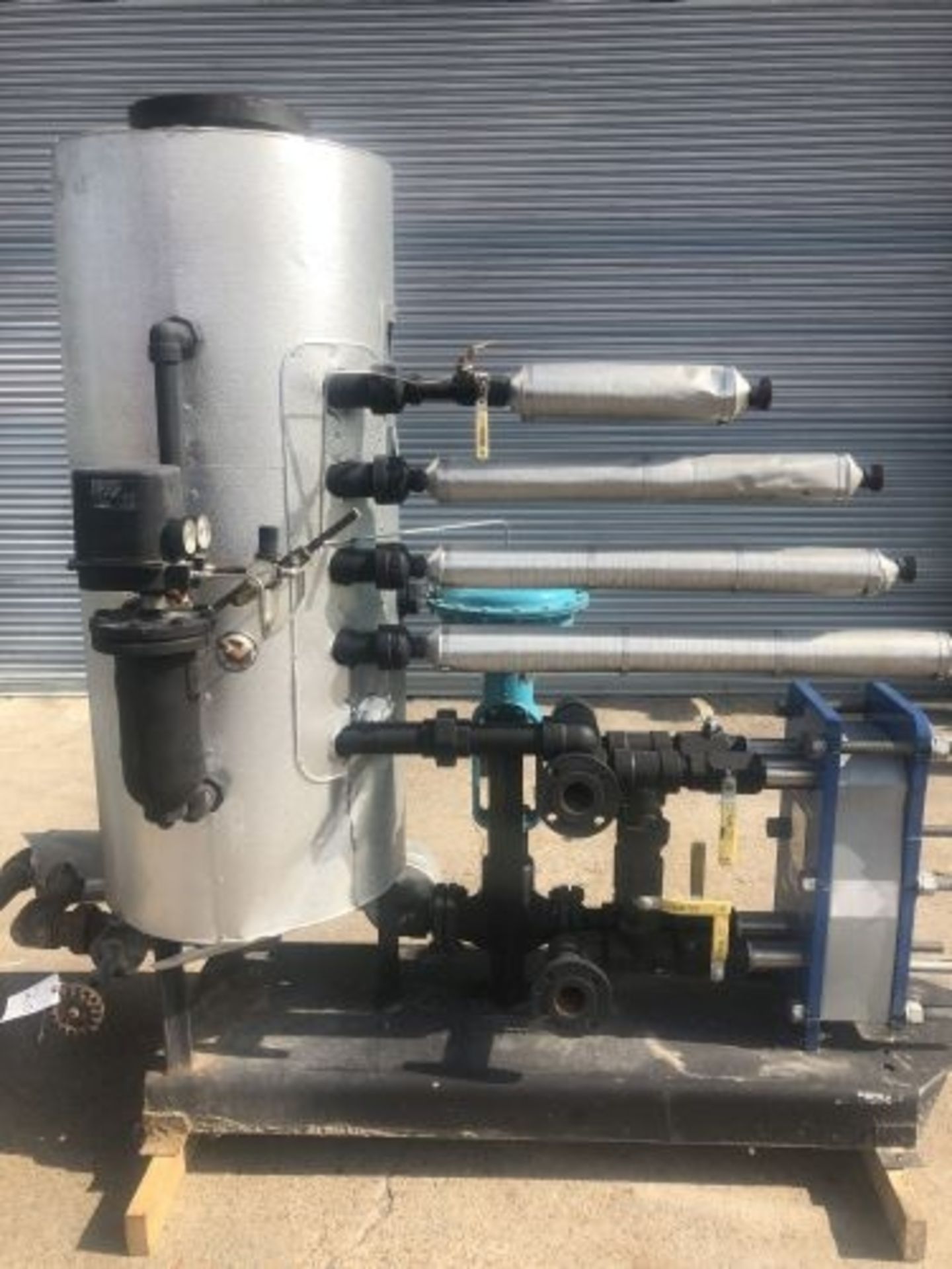 Hot water production skid