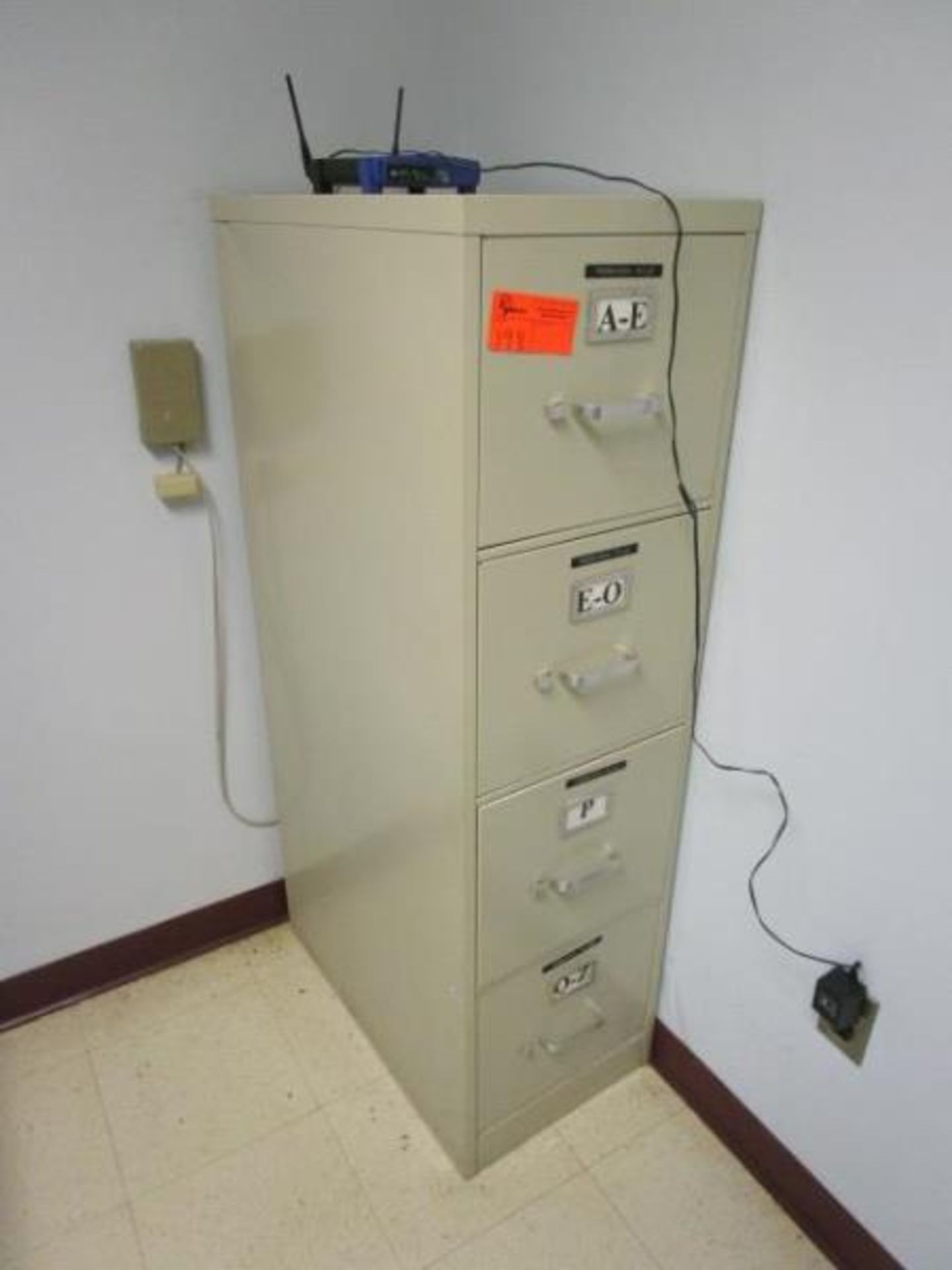 Tan file cabinet with 4 draws