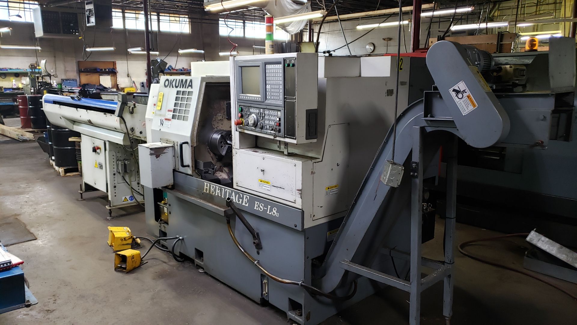 Okuma Heritage ESL8II CNC Lathe, OSPU10L Control, 12 ATC, Chip Conveyor, w/ IEMCA Bar Feeder